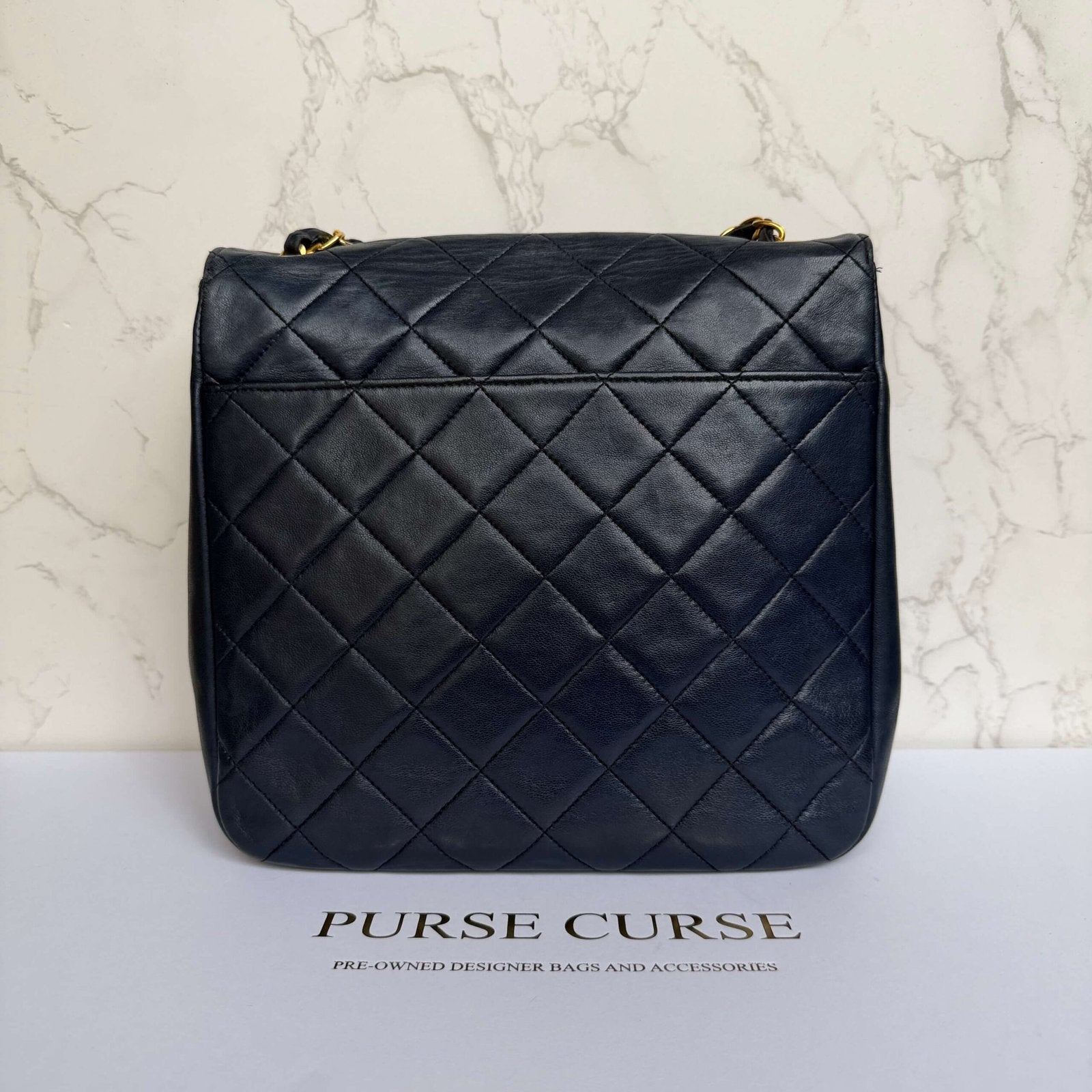 Achterkant Chanel vintage flap bag lamsleer
