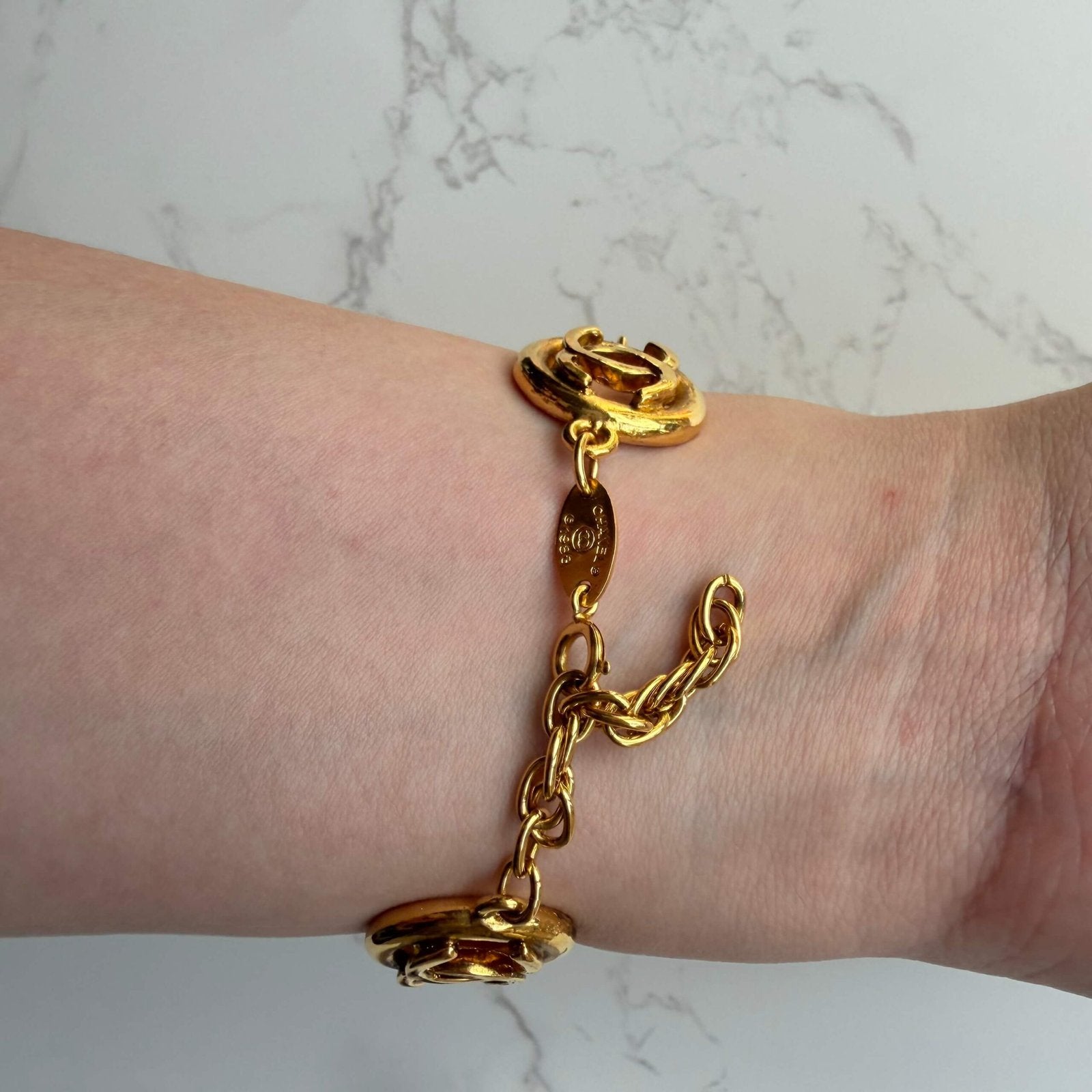 Chanel CC logo armband close up