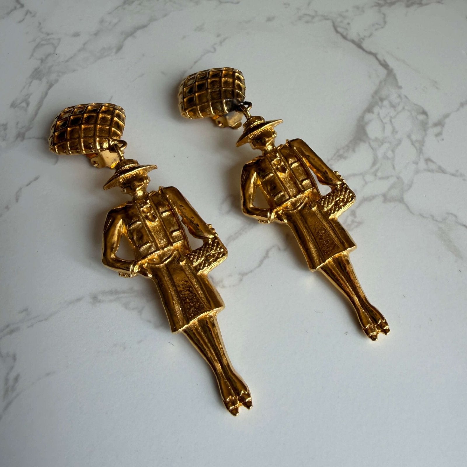 Chanel Mademoiselle earrings feature a dangling design