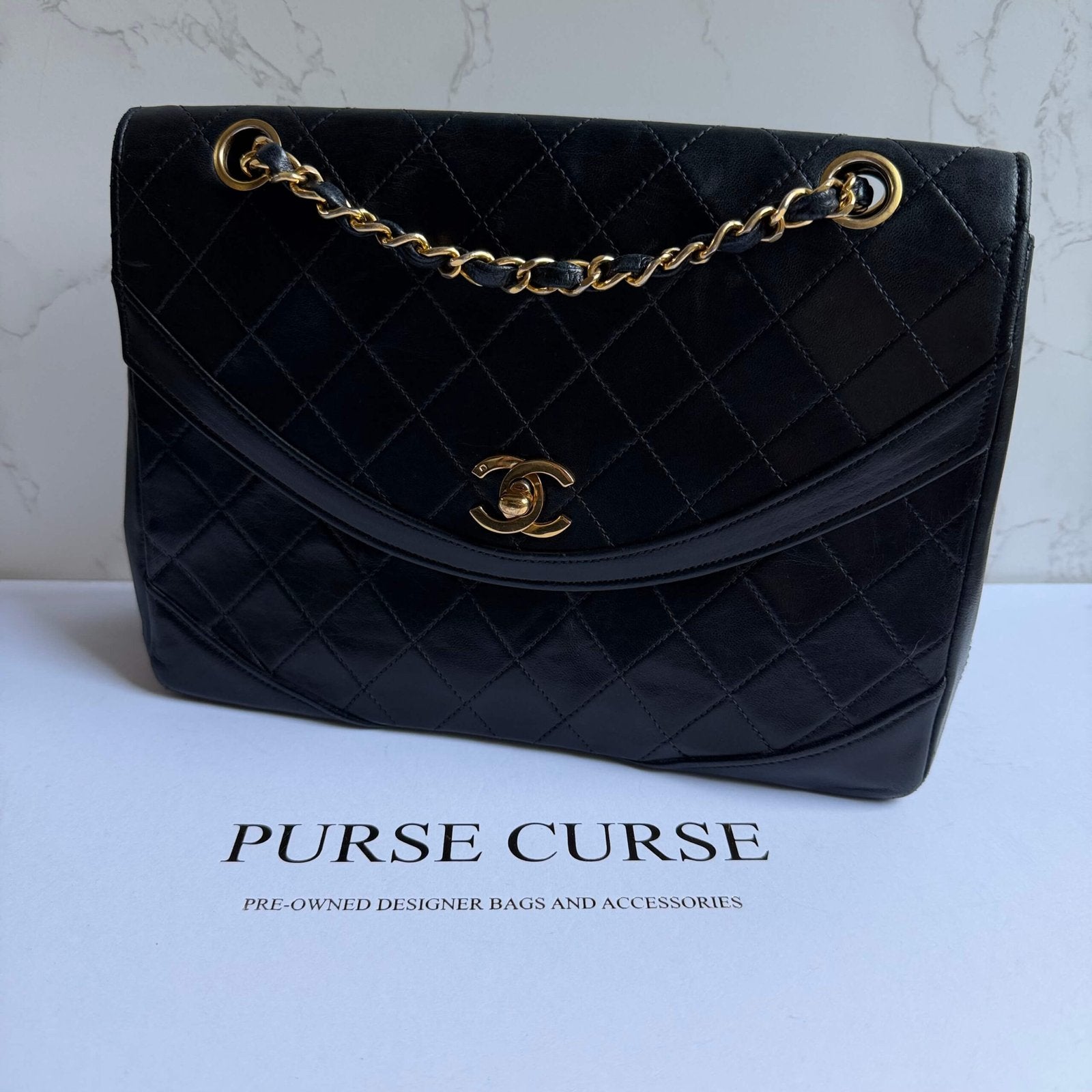 Chanel flap bag black with gold hardware classic bag 1980s