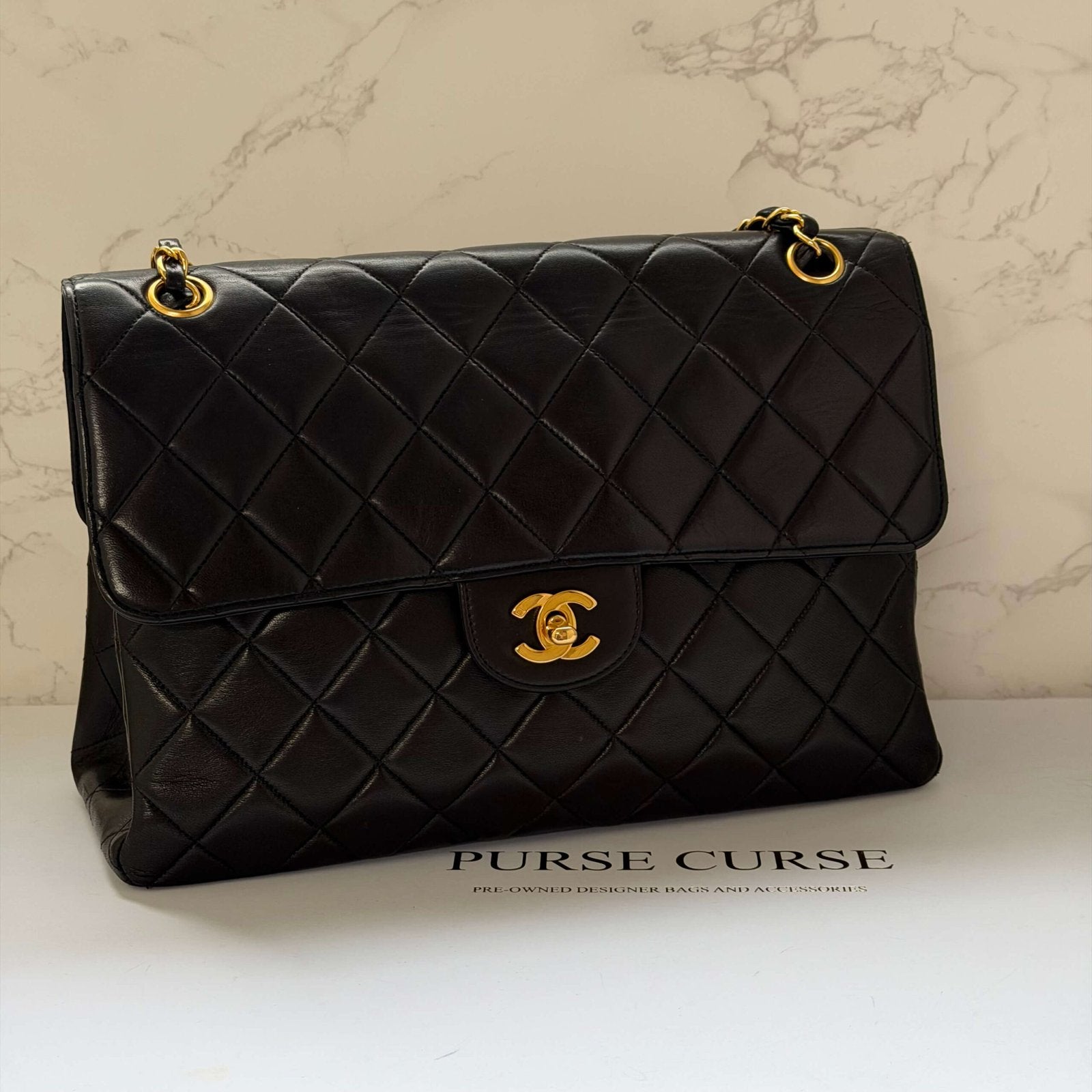 Chanel jumbo flap bag gold chain black lambskin