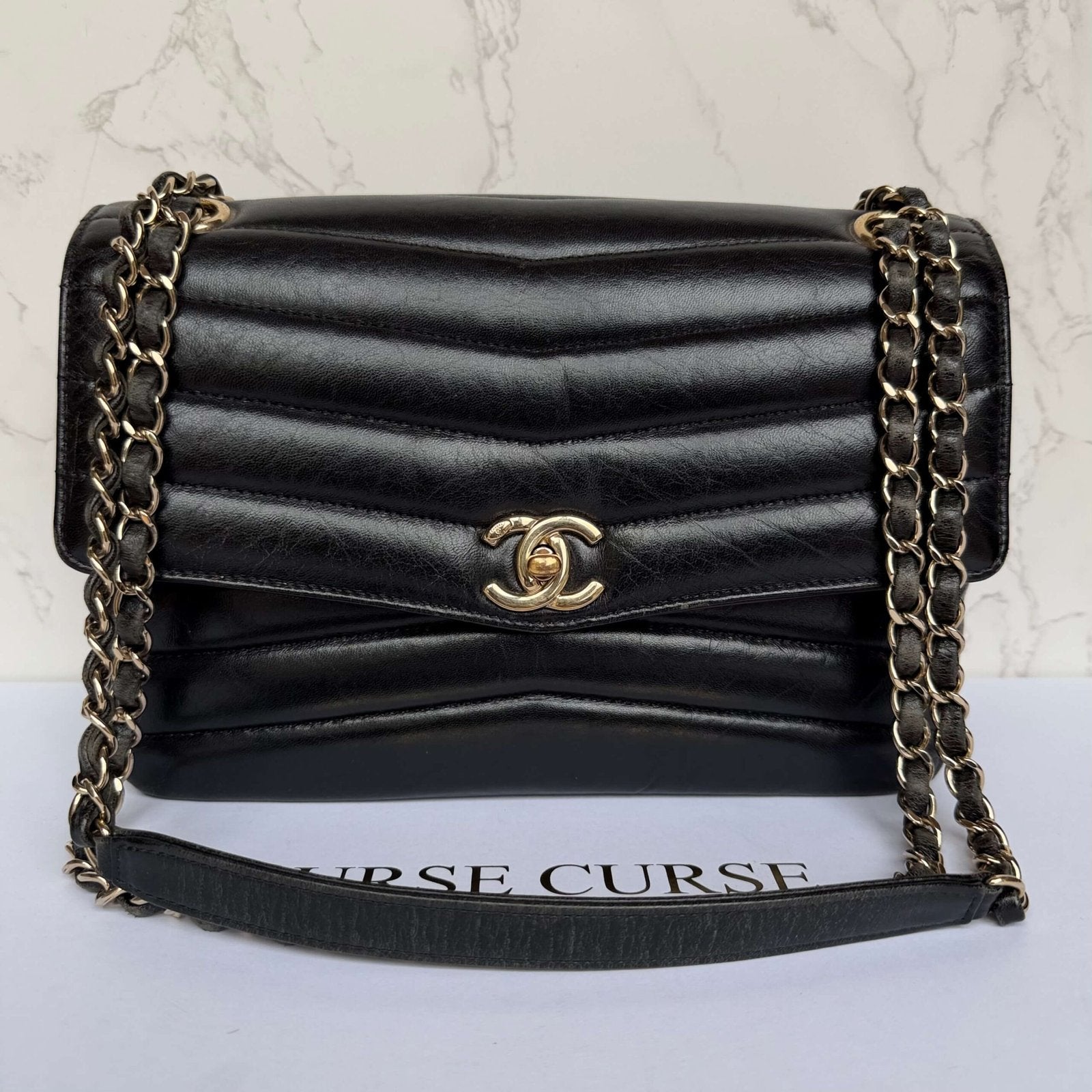 Front view Chanel reversed chevron flap bag