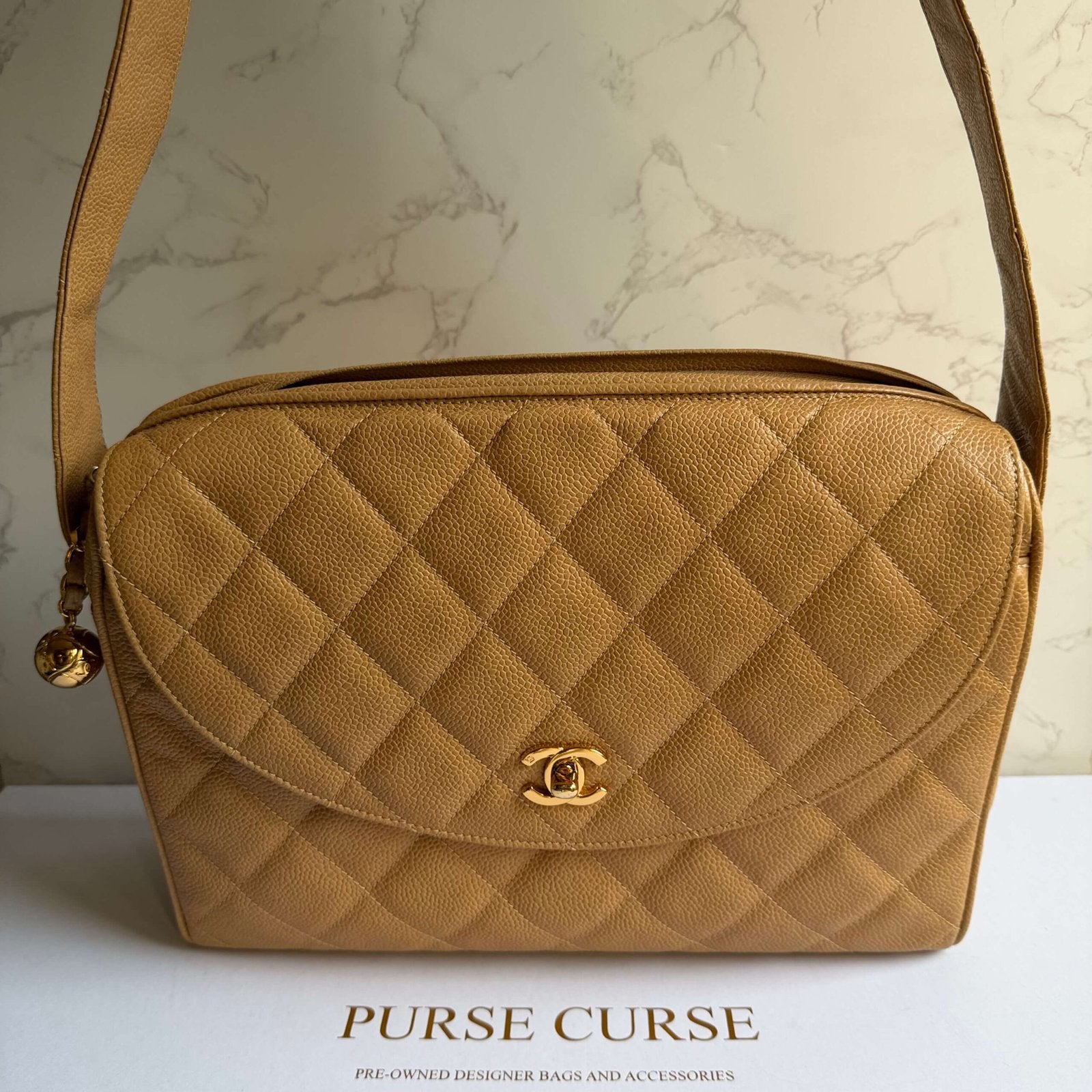 Chanel vintage quilted caviar bag beige