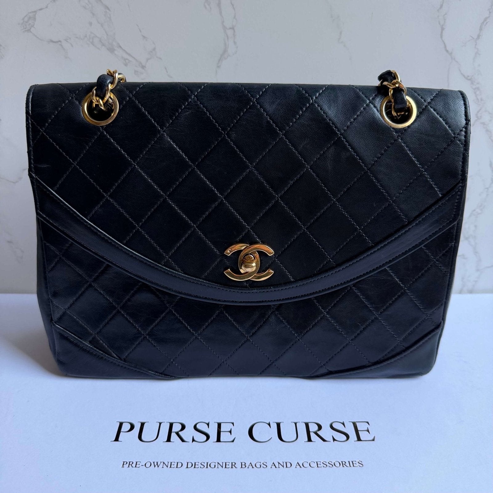 Chanel vintage bag black with gold hardware chain strap detail