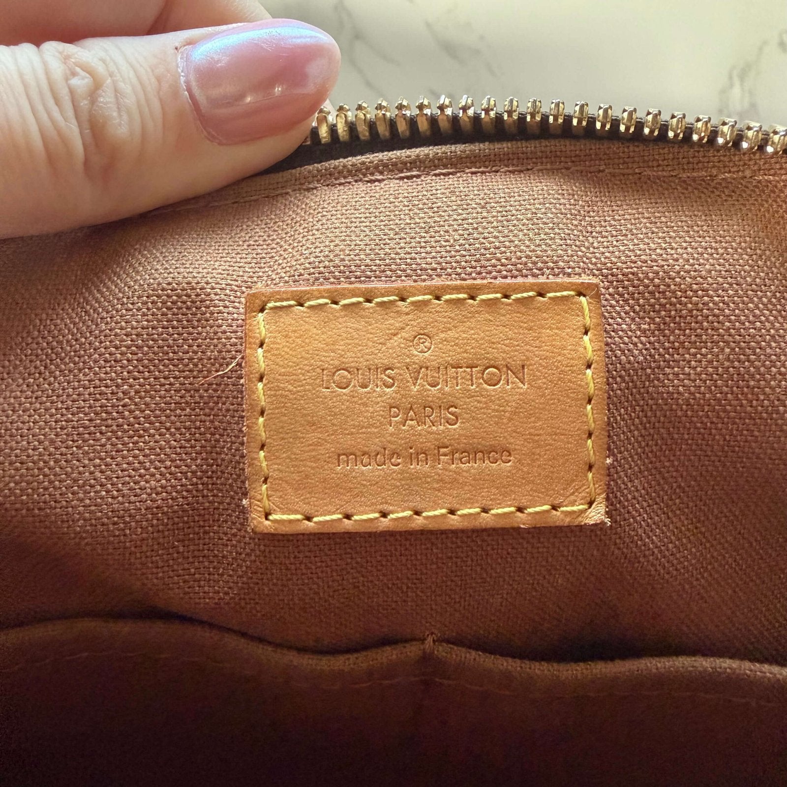 Date code inside Louis Vuitton Tivoli PM