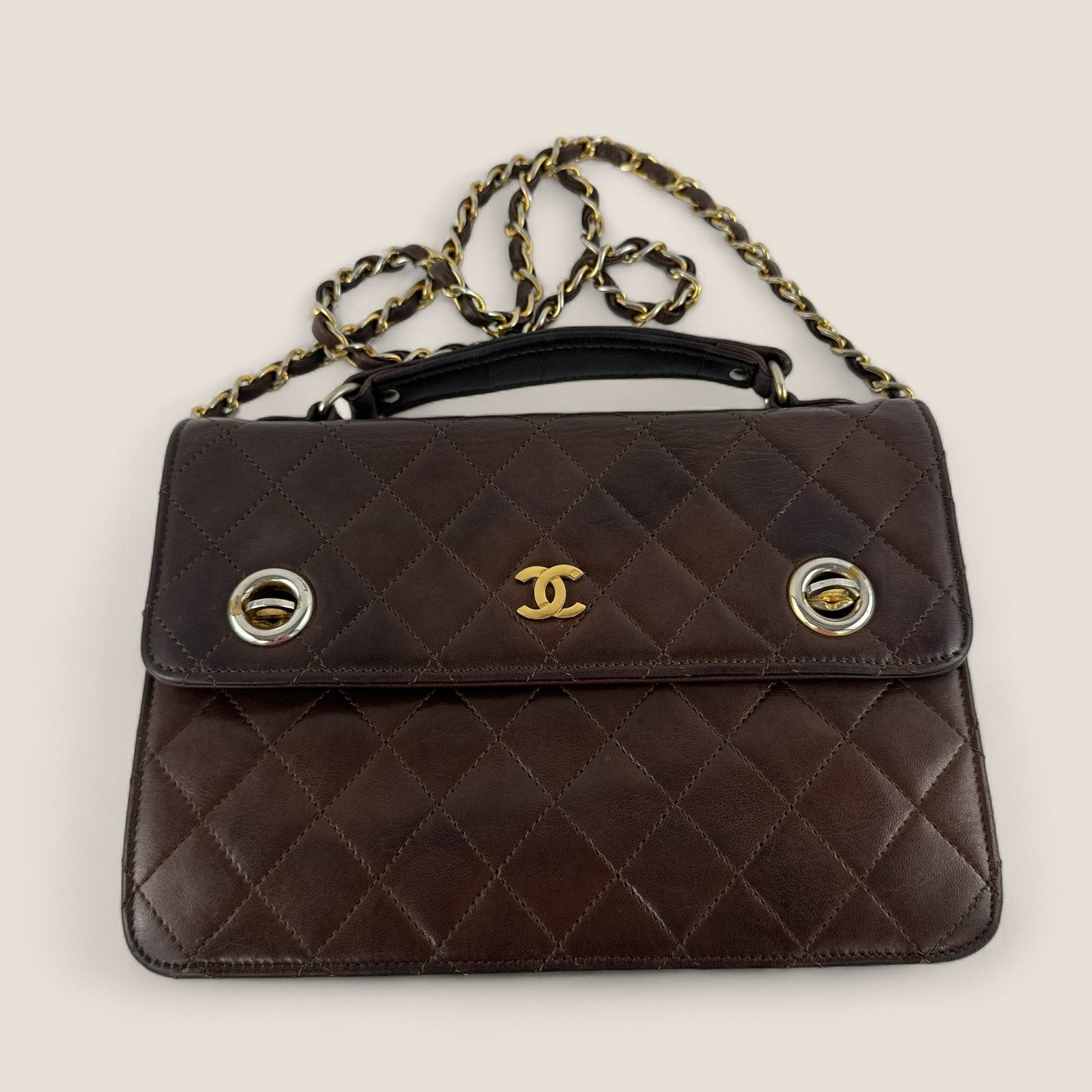 Pre-owned Chanel bag with two locks, top handle and chain