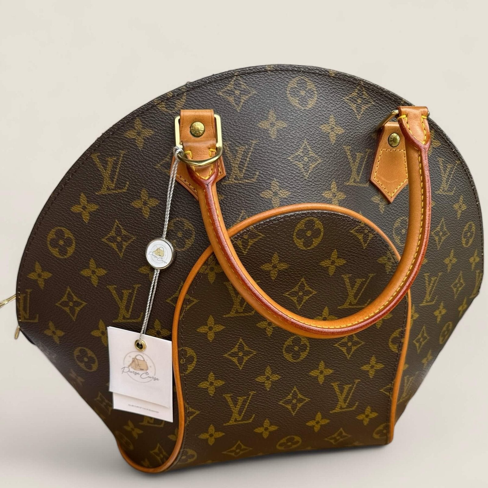 Purse Curse hang tag on preloved Louis Vuitton Elipse handbag