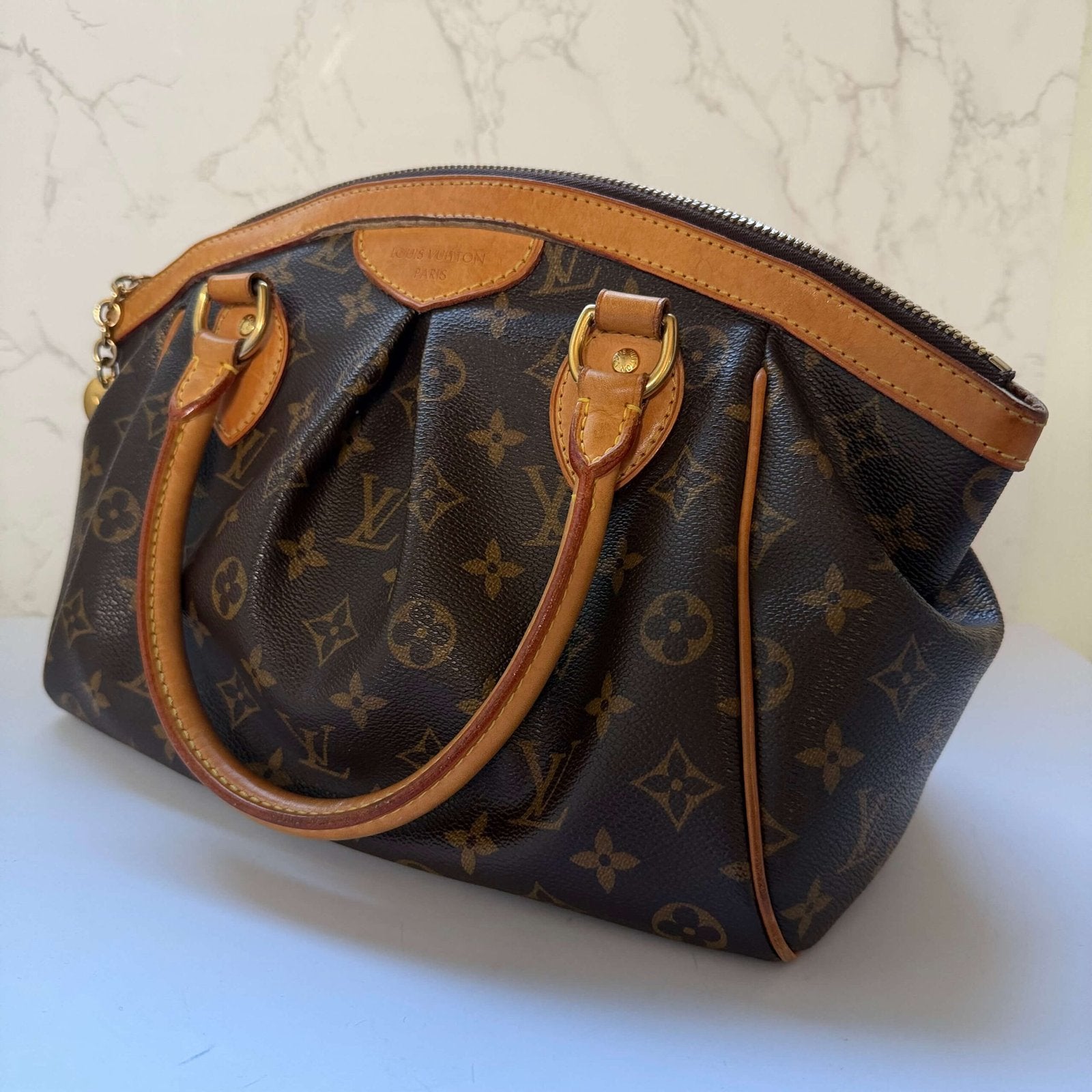 Angled front view of vintage Louis Vuitton Tivoli PM