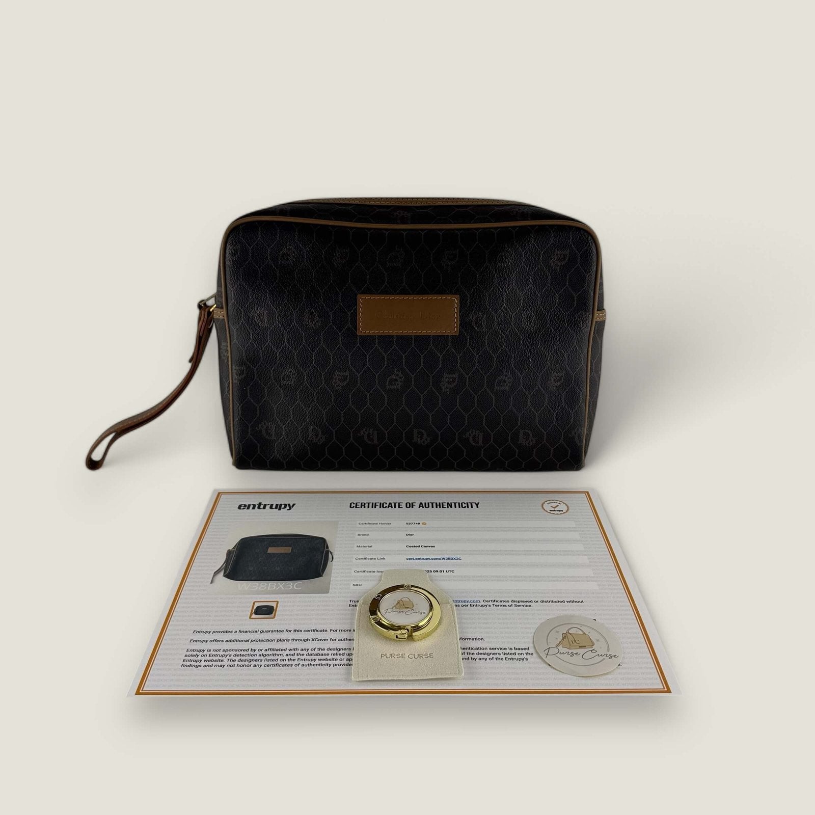 Tweedehands designer Christian Dior honingraat gecoate canvas monogram clutch Entrupy certificaat
