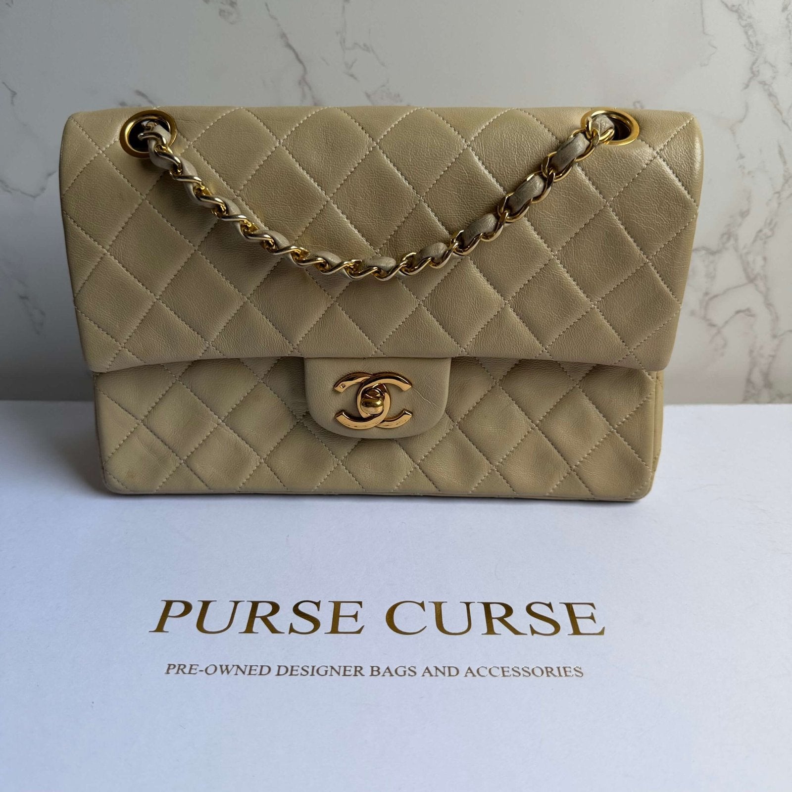 Vintage Chanel small classic flap beige lambskin