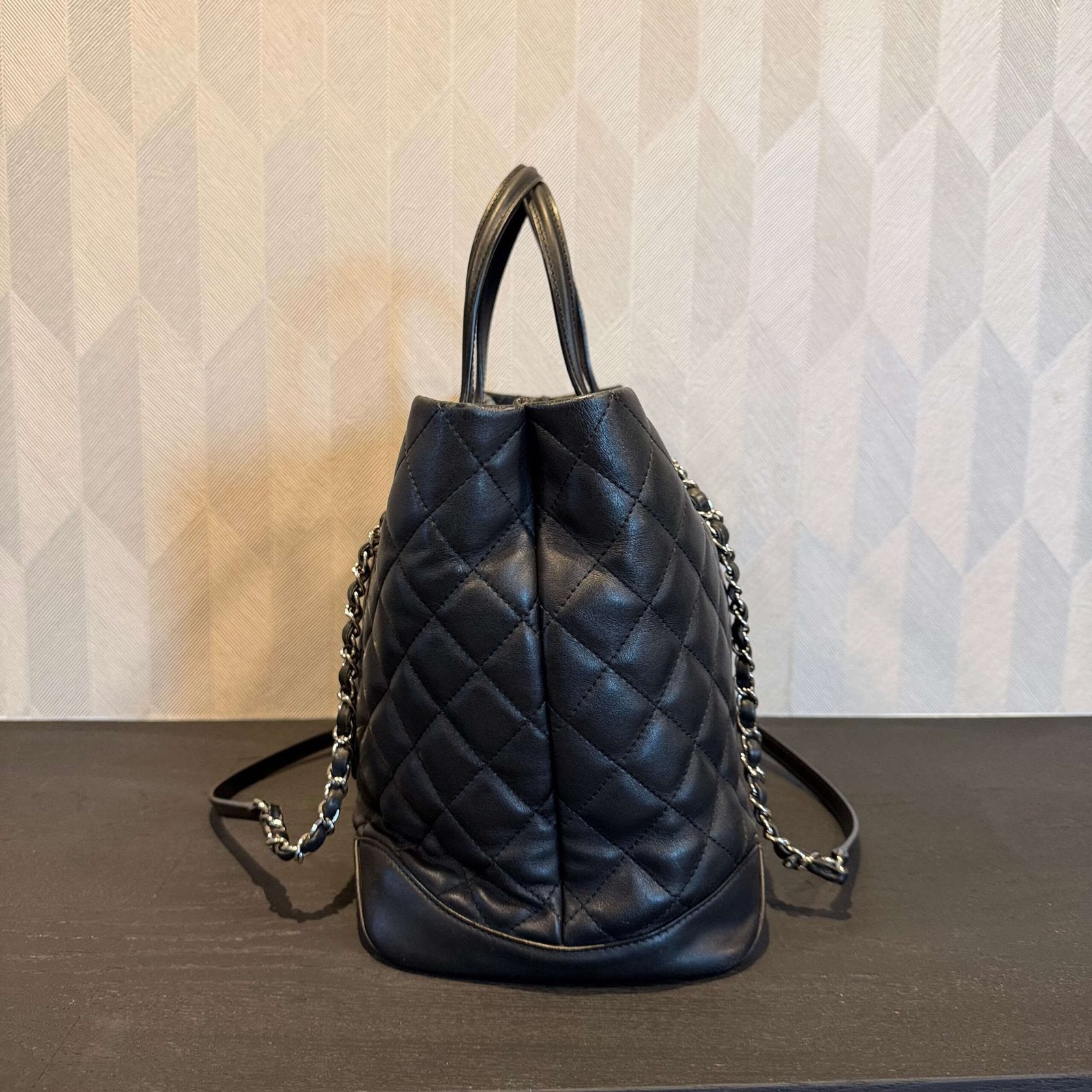 Side view of Chanel calfskin quilted large shopping tote