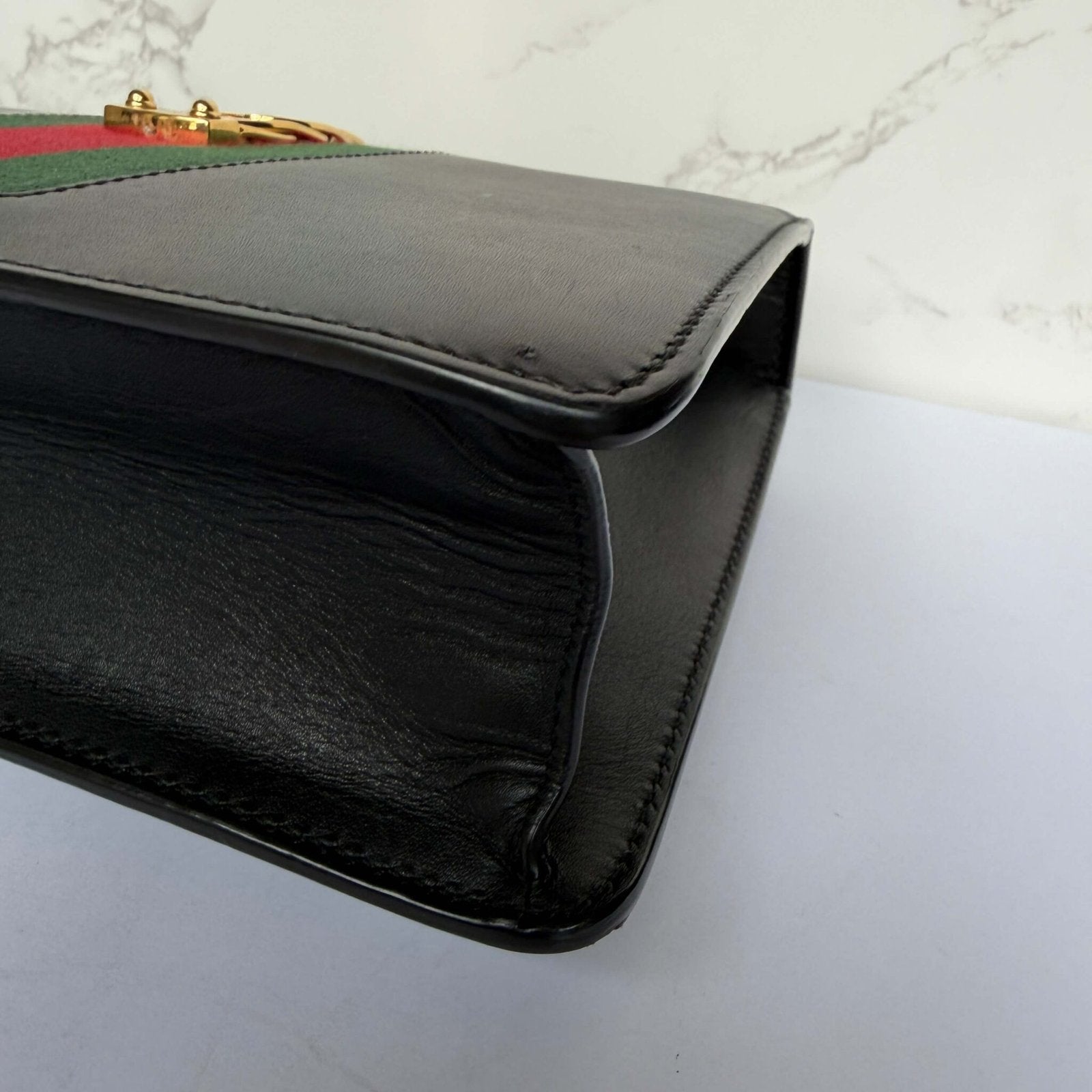 Signs of wear on the pre-owned Gucci bag