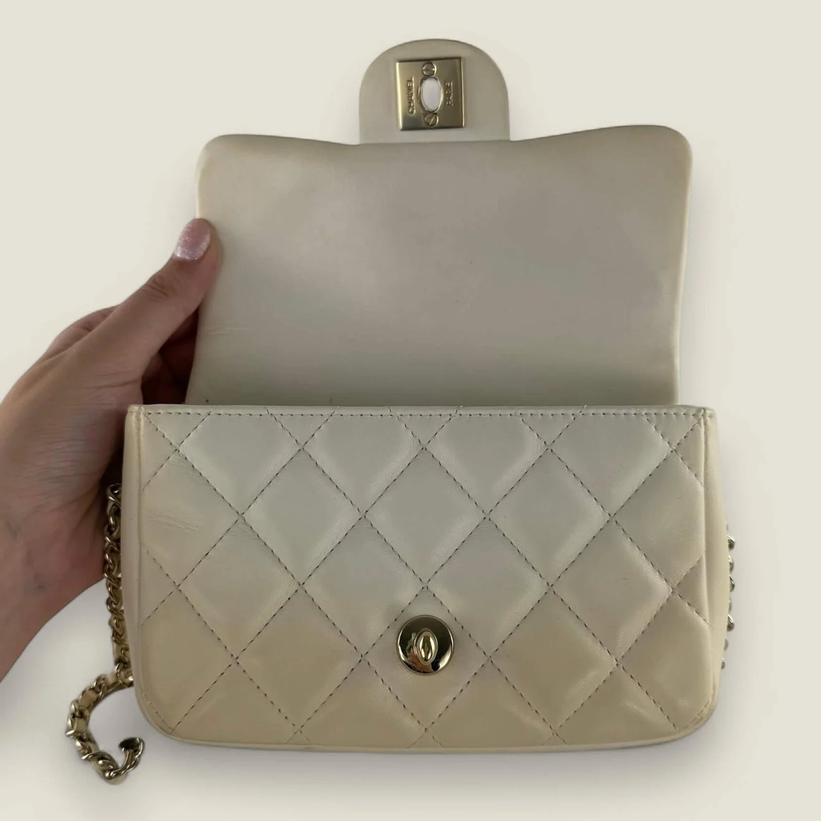 Interior original Chanel mini crossbody cream
