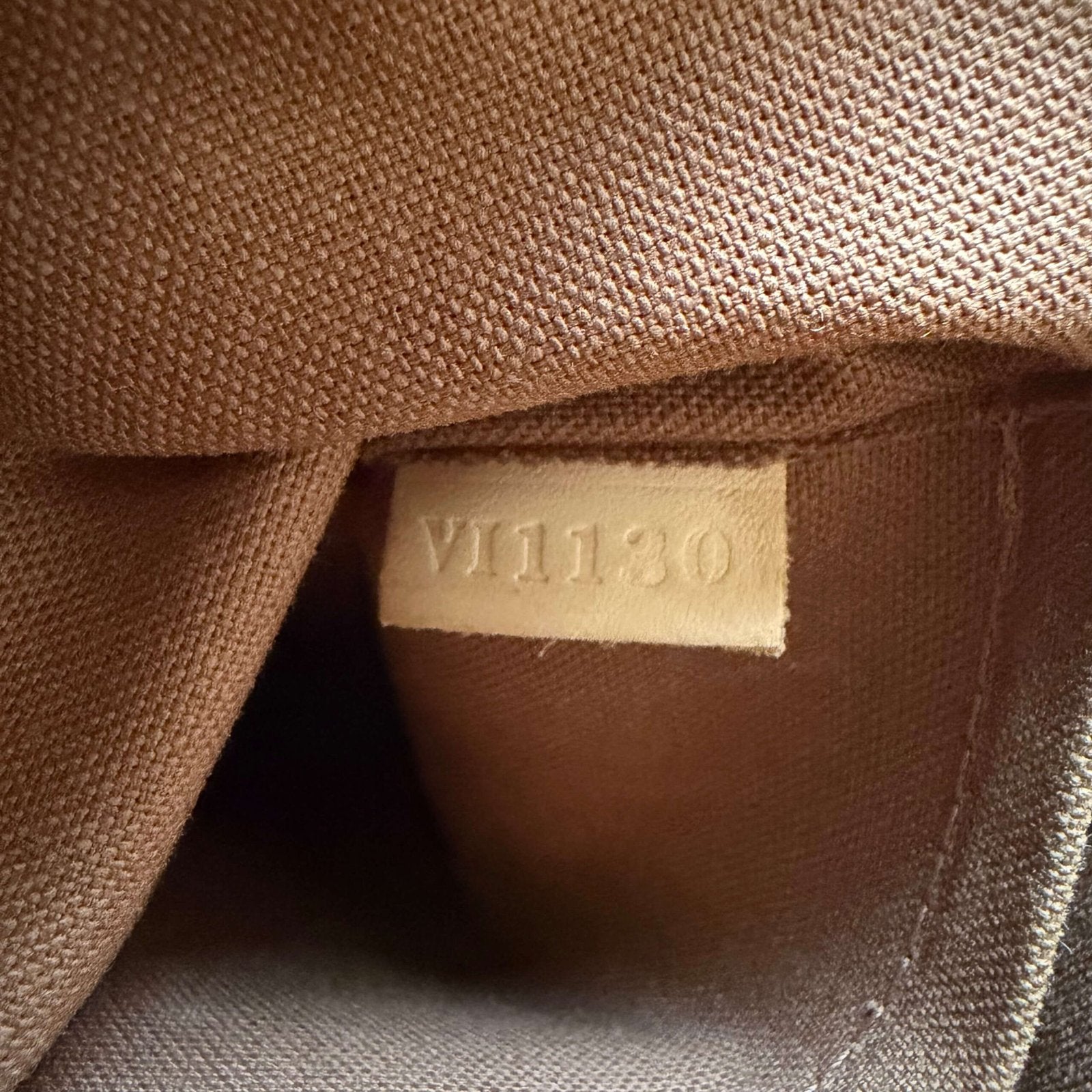 Interior lining detail of vintage Louis Vuitton Monogram bag