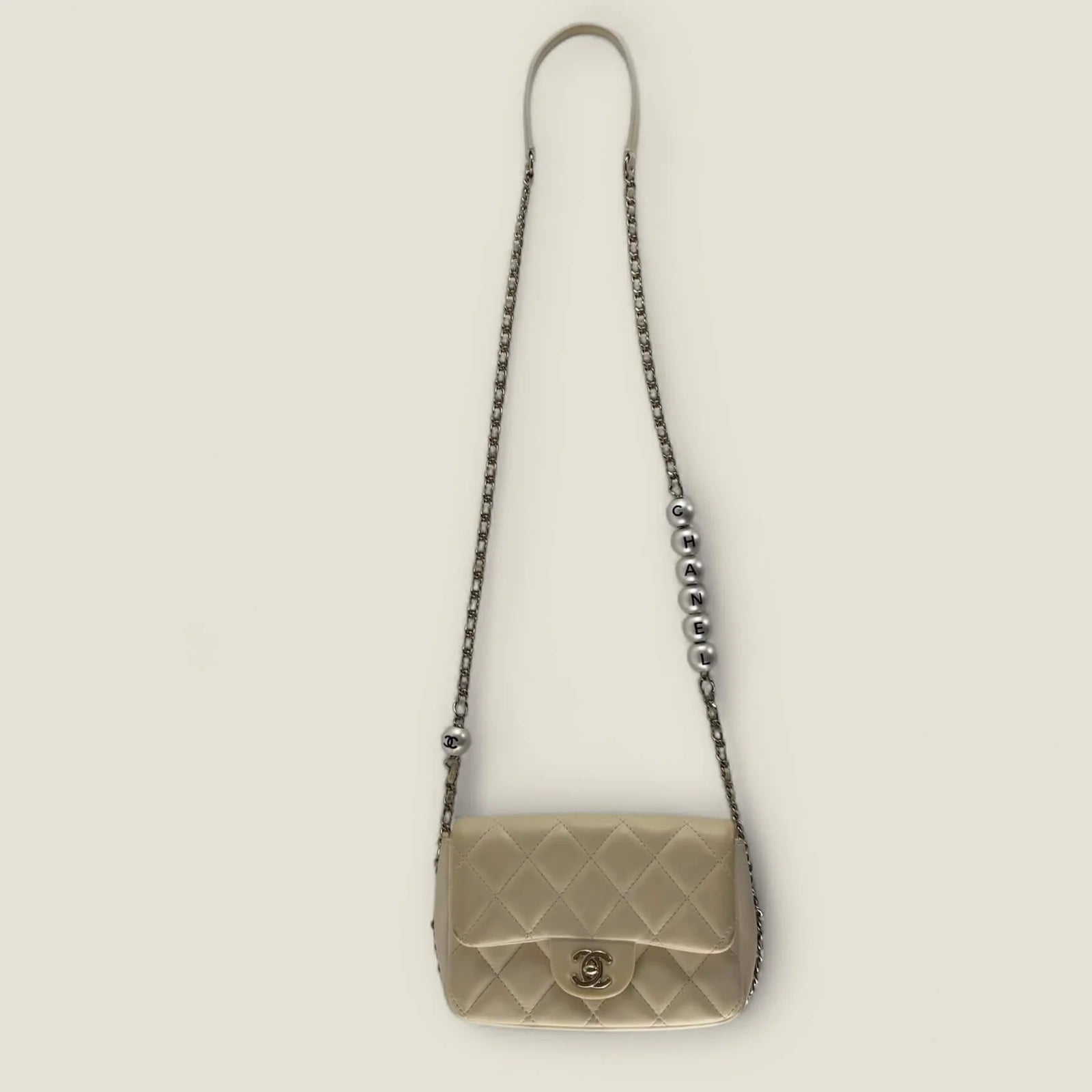 Chanel Mini Flap vintage – pearls with CHANEL letters