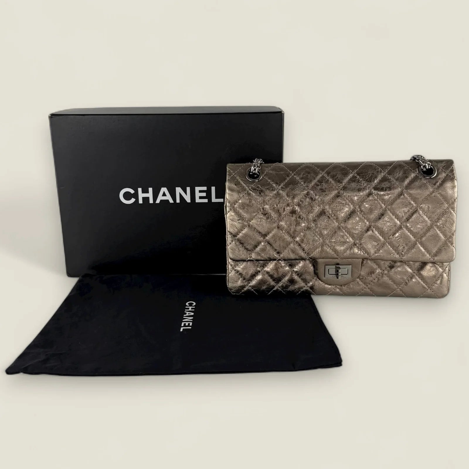 Chanel Reissue 226 metallic bronze met dustbag & doos