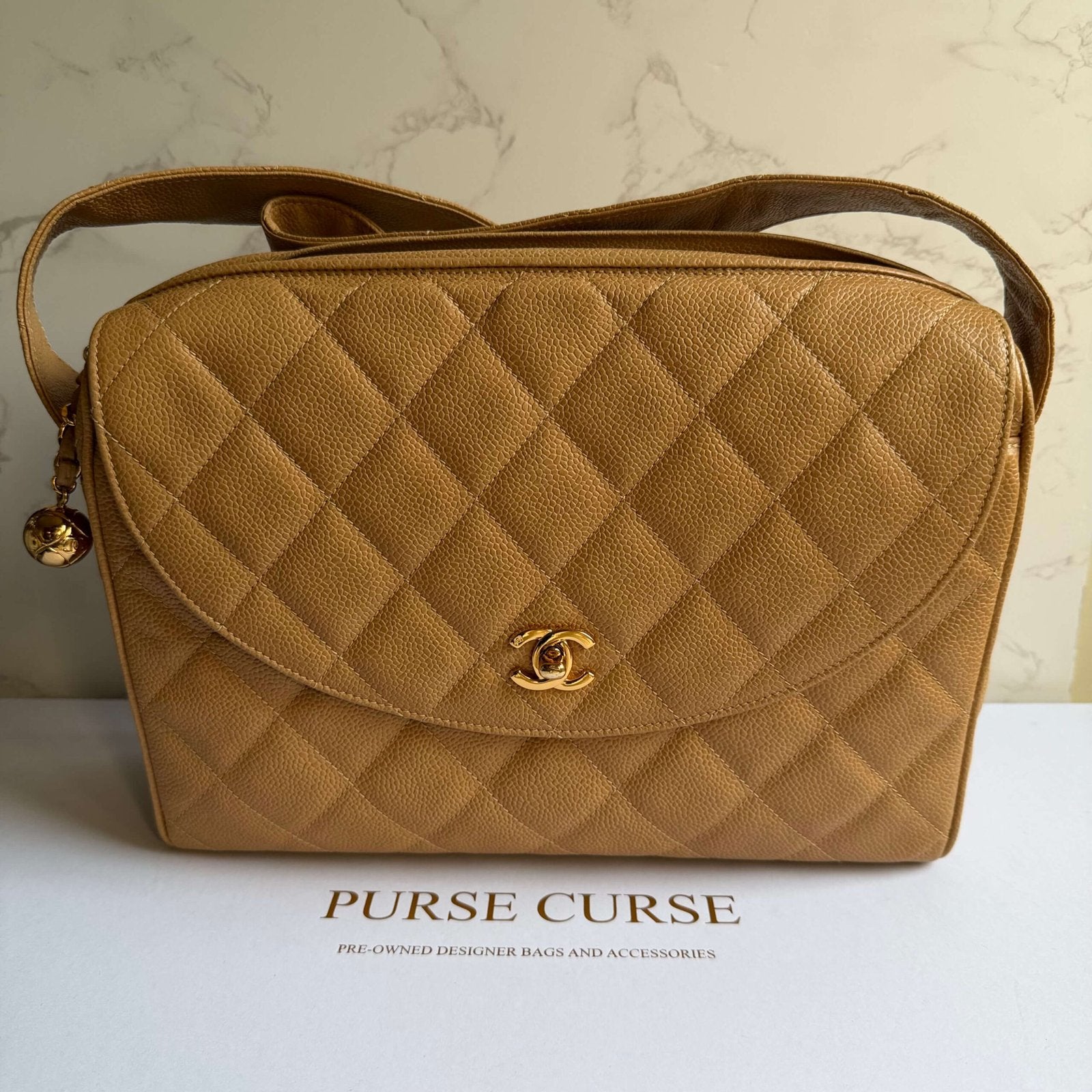 Chanel classic caviar camera bag beige