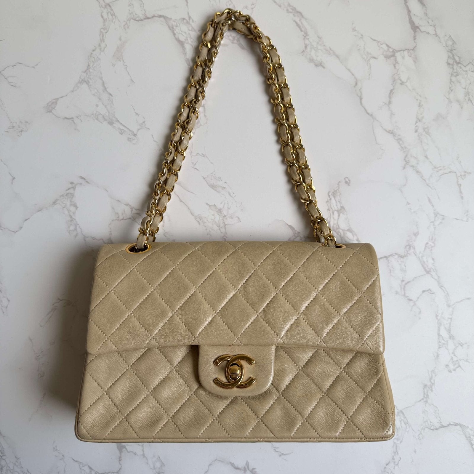 Chanel classic flap bag beige front view