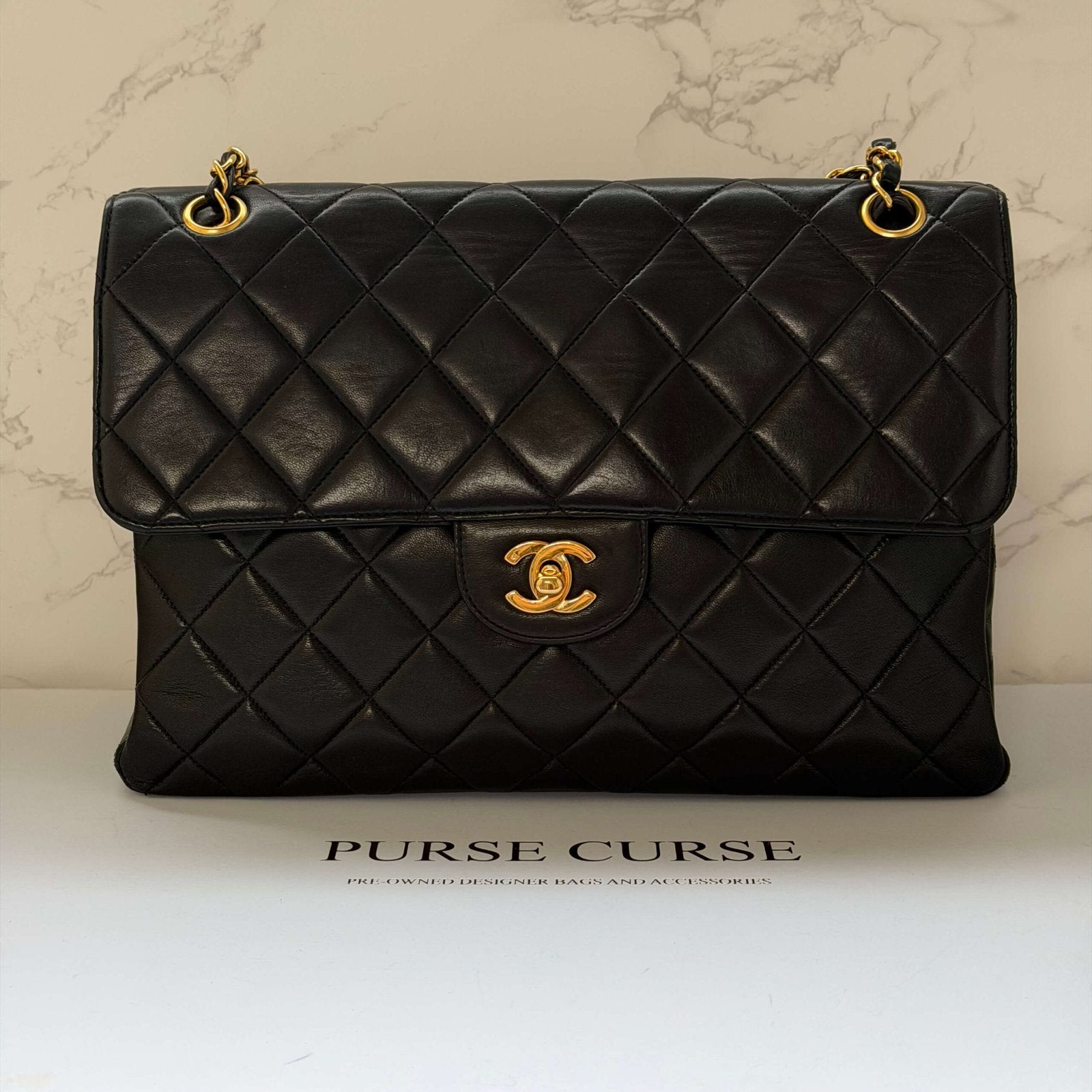 Chanel double sided flap bag black lambskin gold hardware<br>