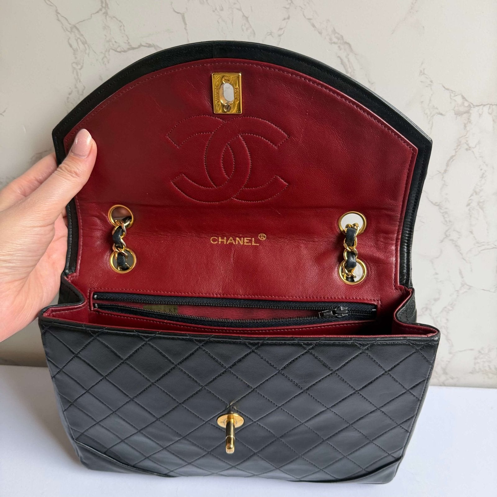 Chanel flap bag black lambskin vintage elegant design