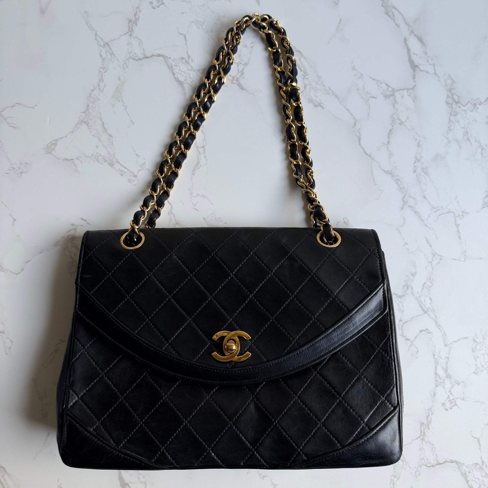 Chanel flap bag black lambskin with gold CC lock detail