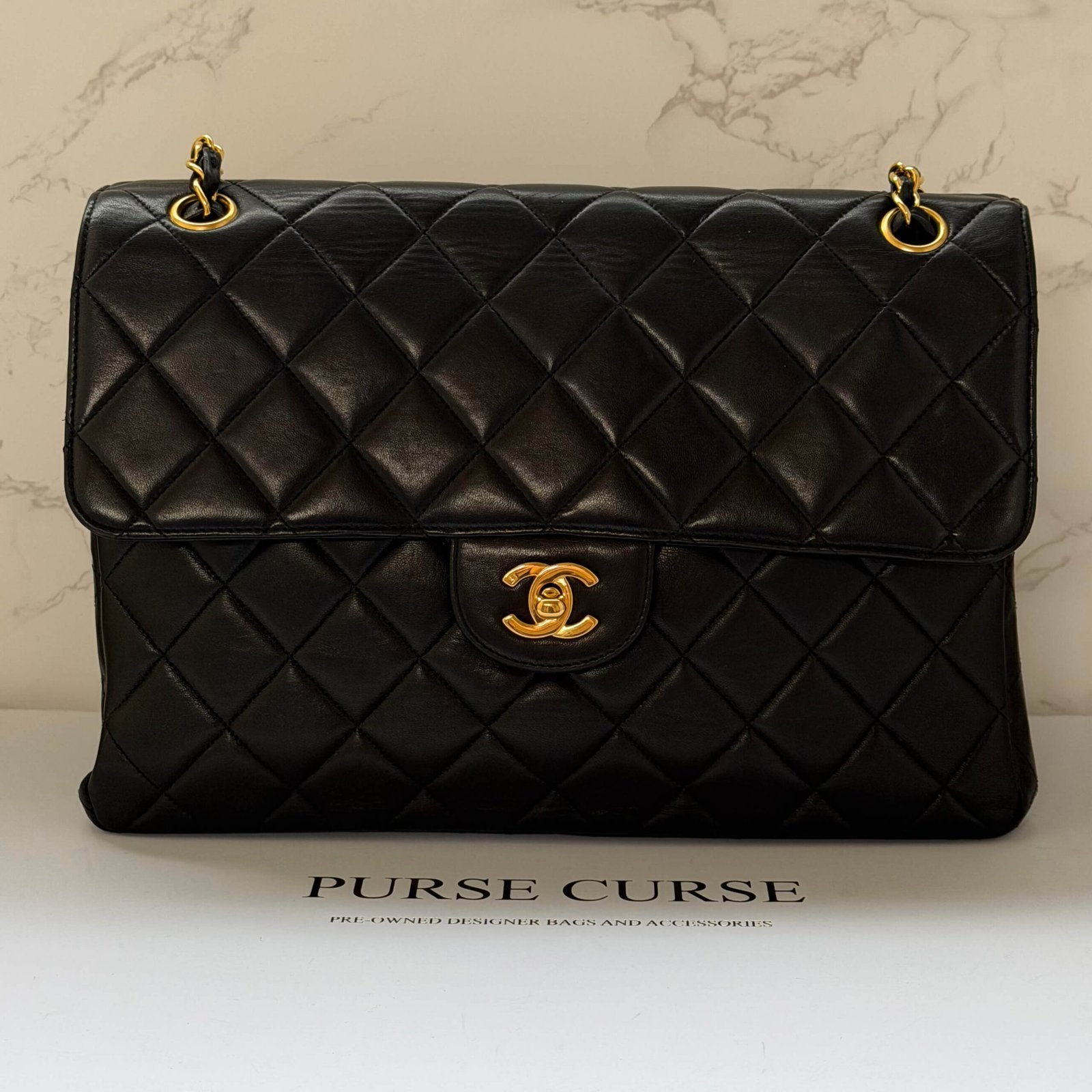 Chanel jumbo vintage bag black lambskin close up