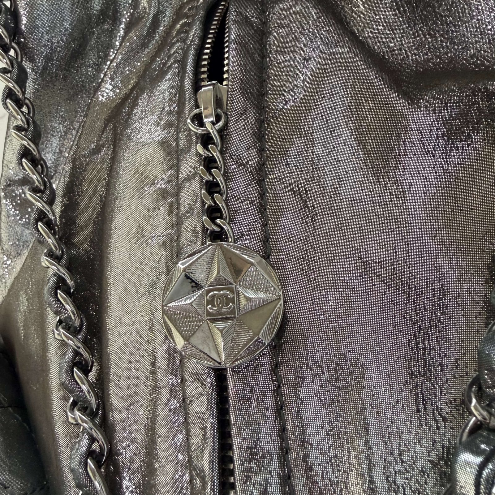 Chanel metallic backpack zipper detail<br>
