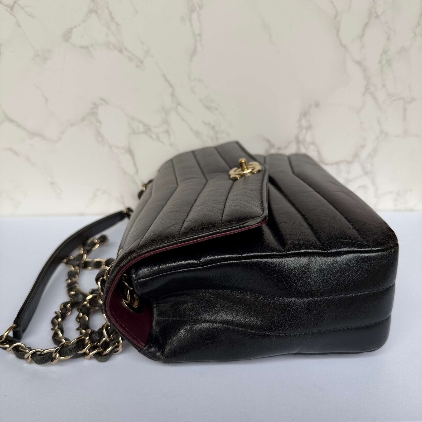 Chanel reversed chevron flap bag side view