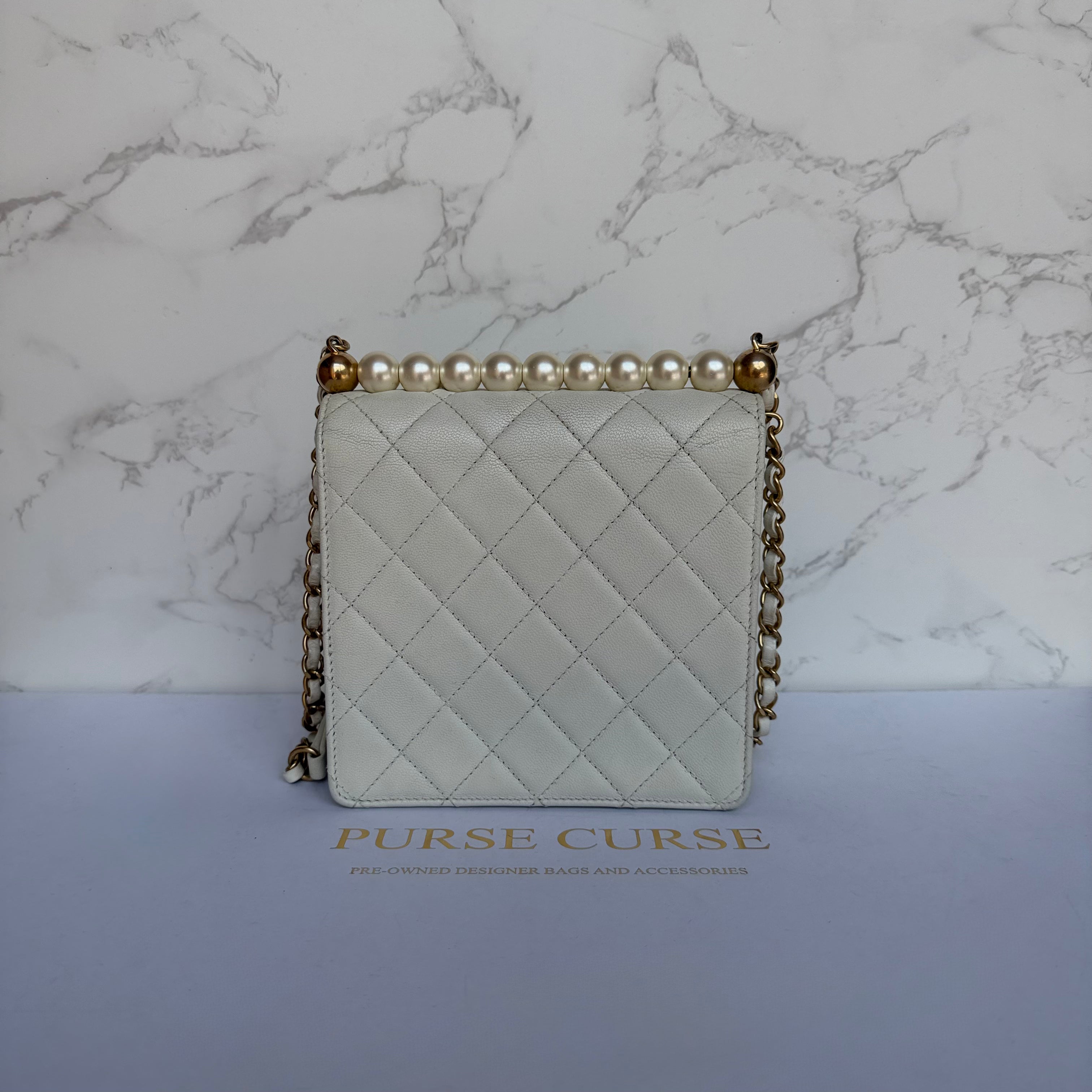Chanel chic pearl flap bag