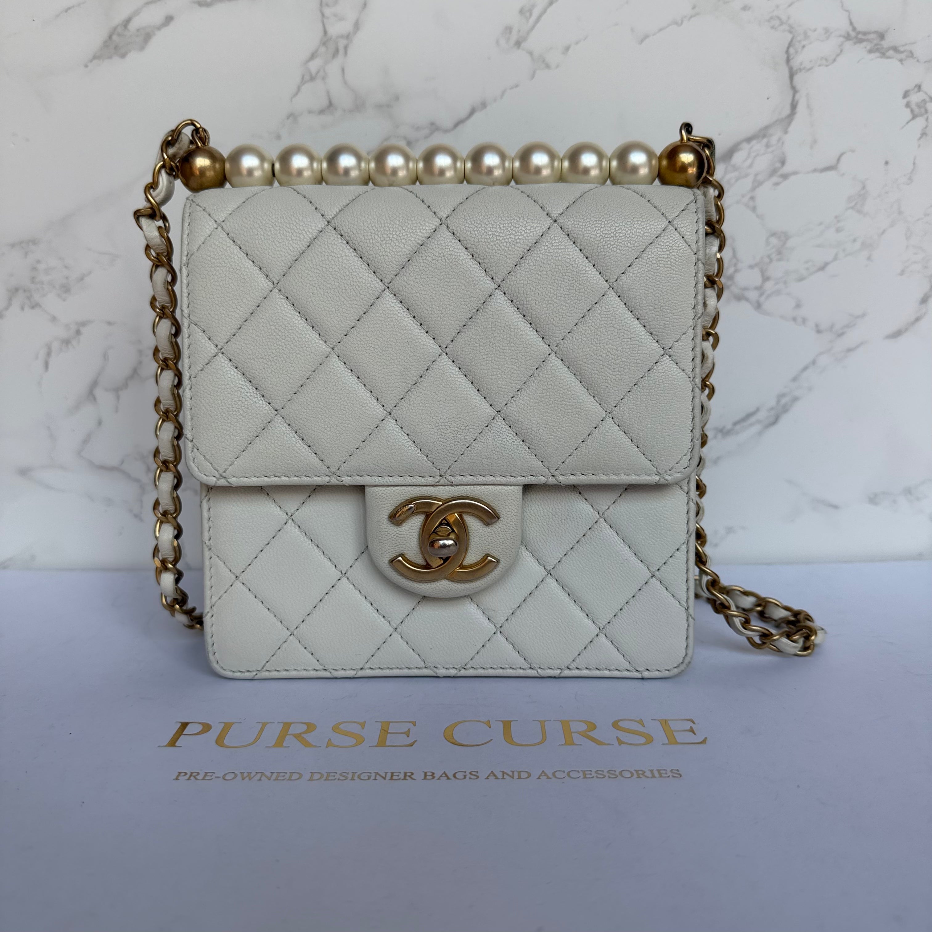 Chanel chic pearl flap bag