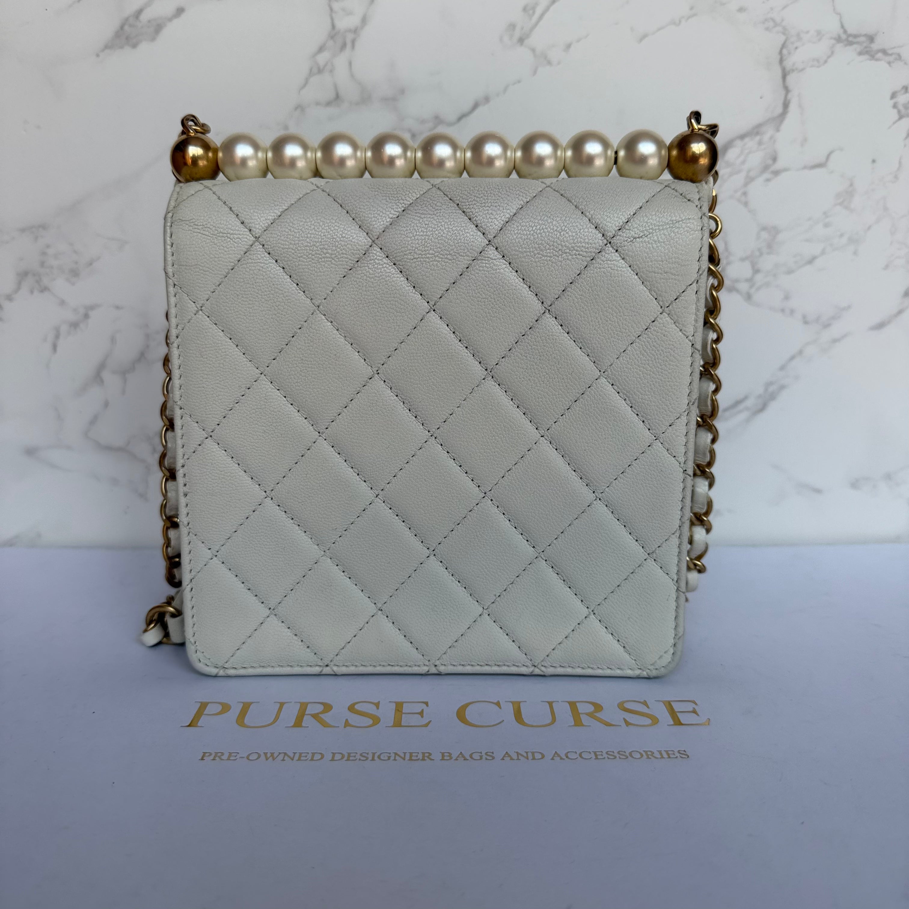 Chanel chic pearl flap bag