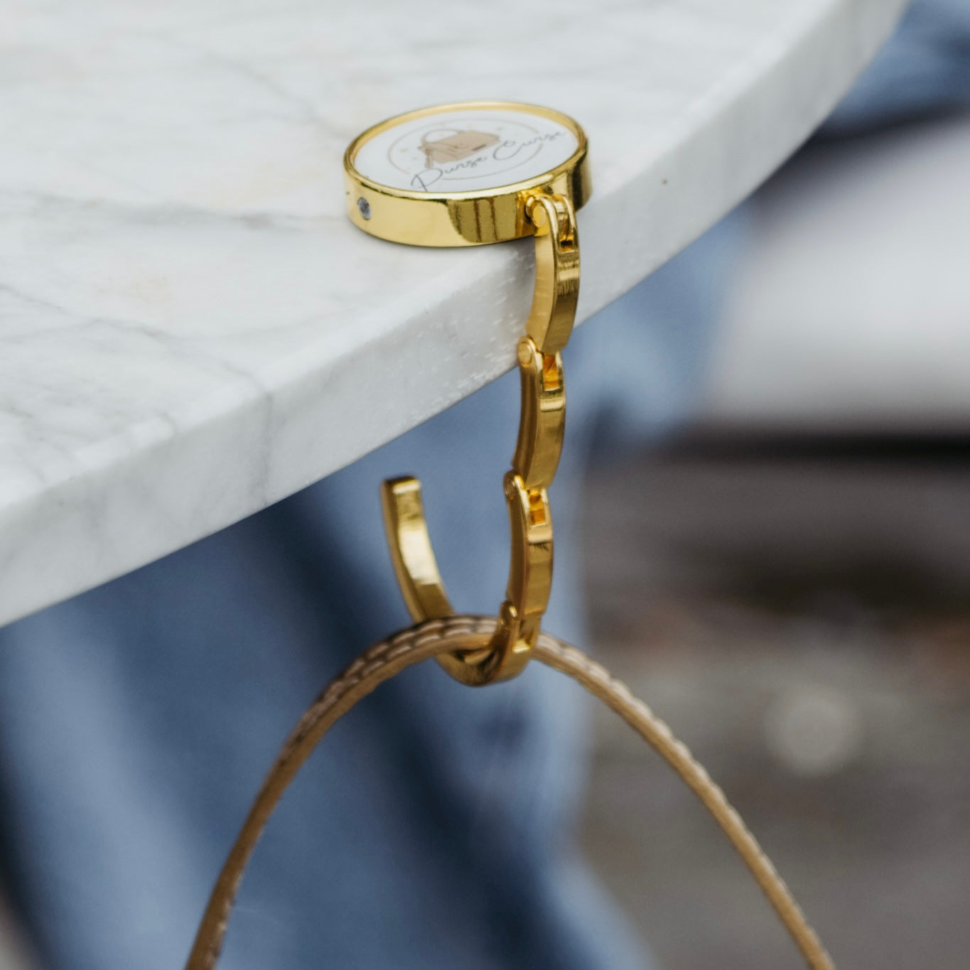 Designer bag holder for the table