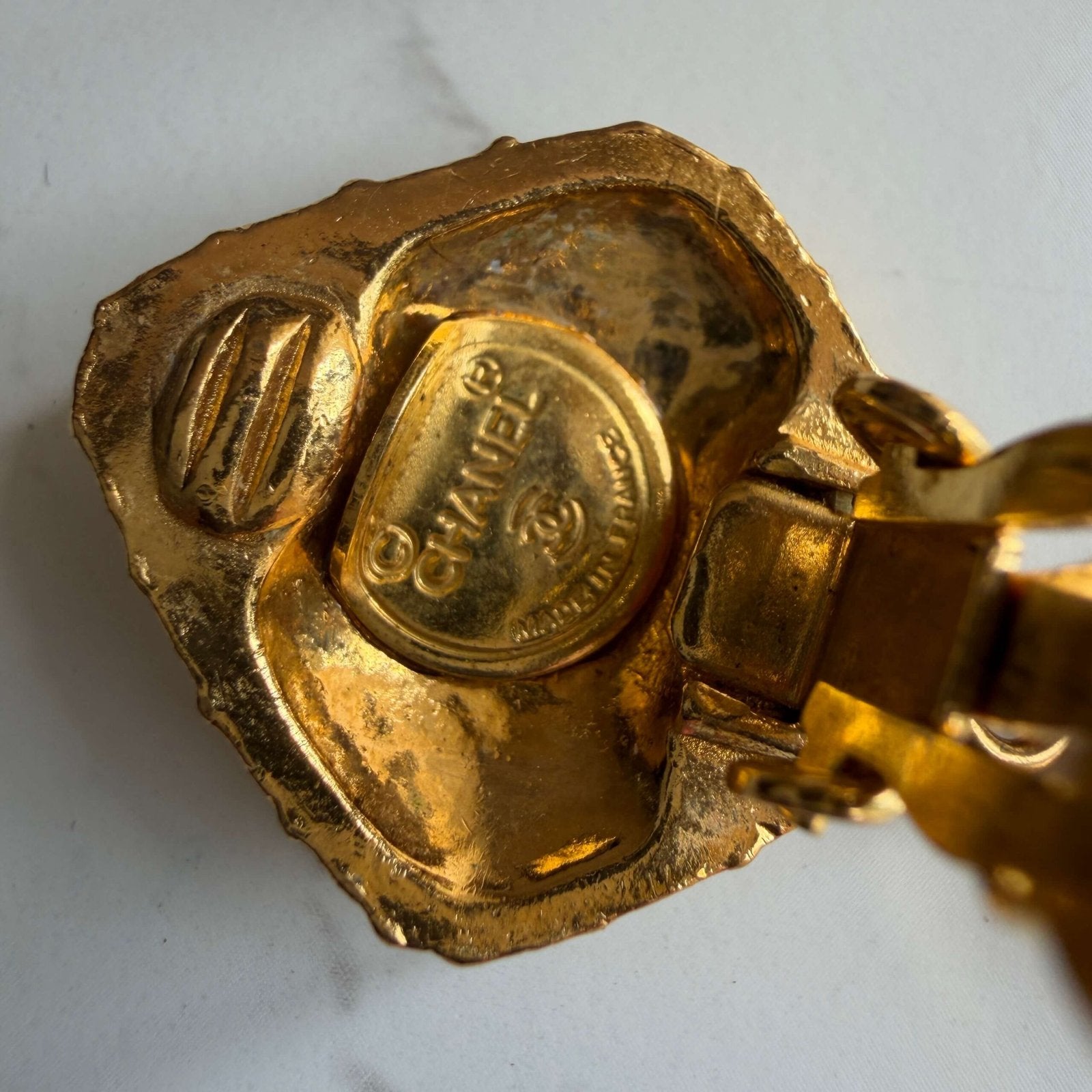 Detail of the original vintage Chanel clip-on earrings