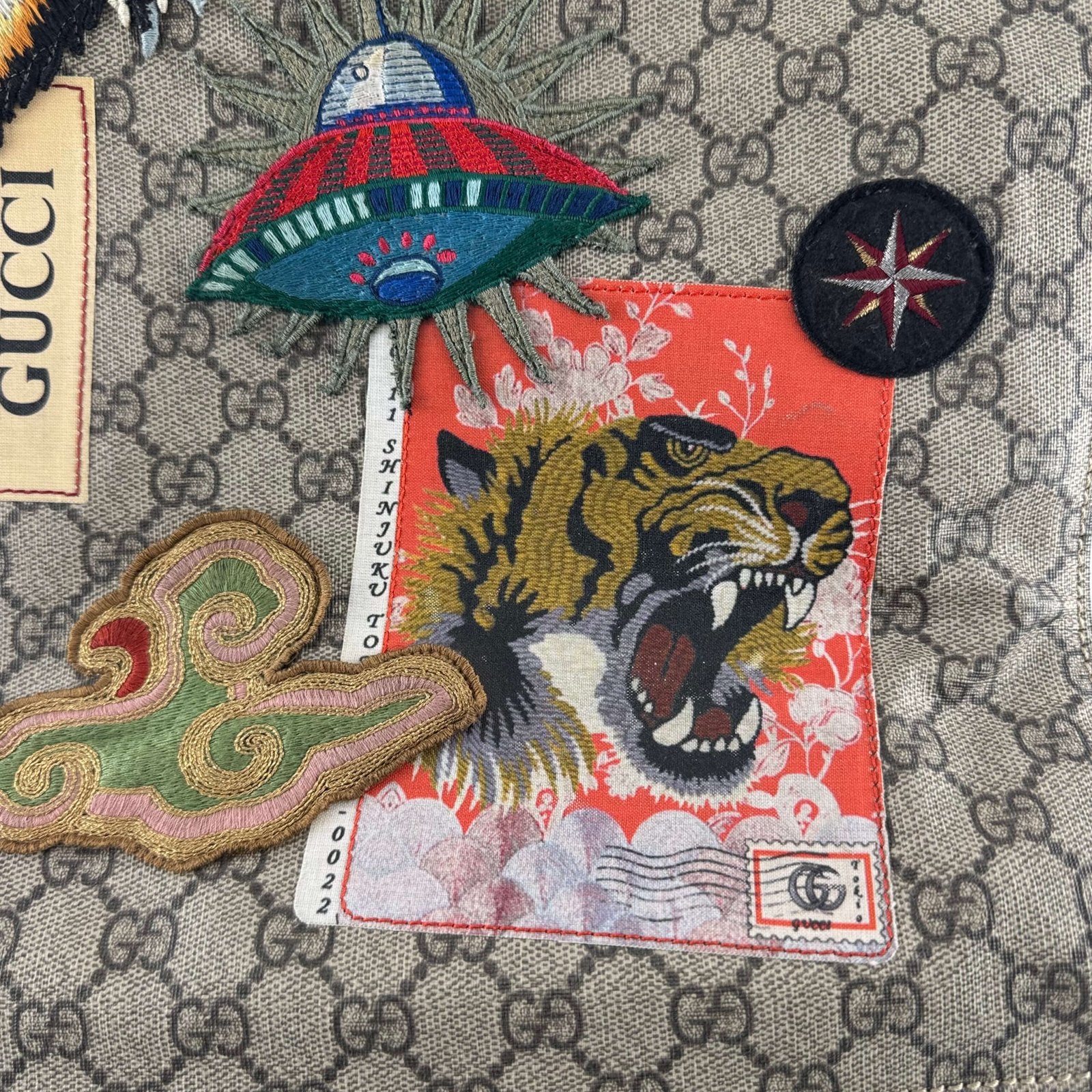 Detail of the patches on Gucci bag