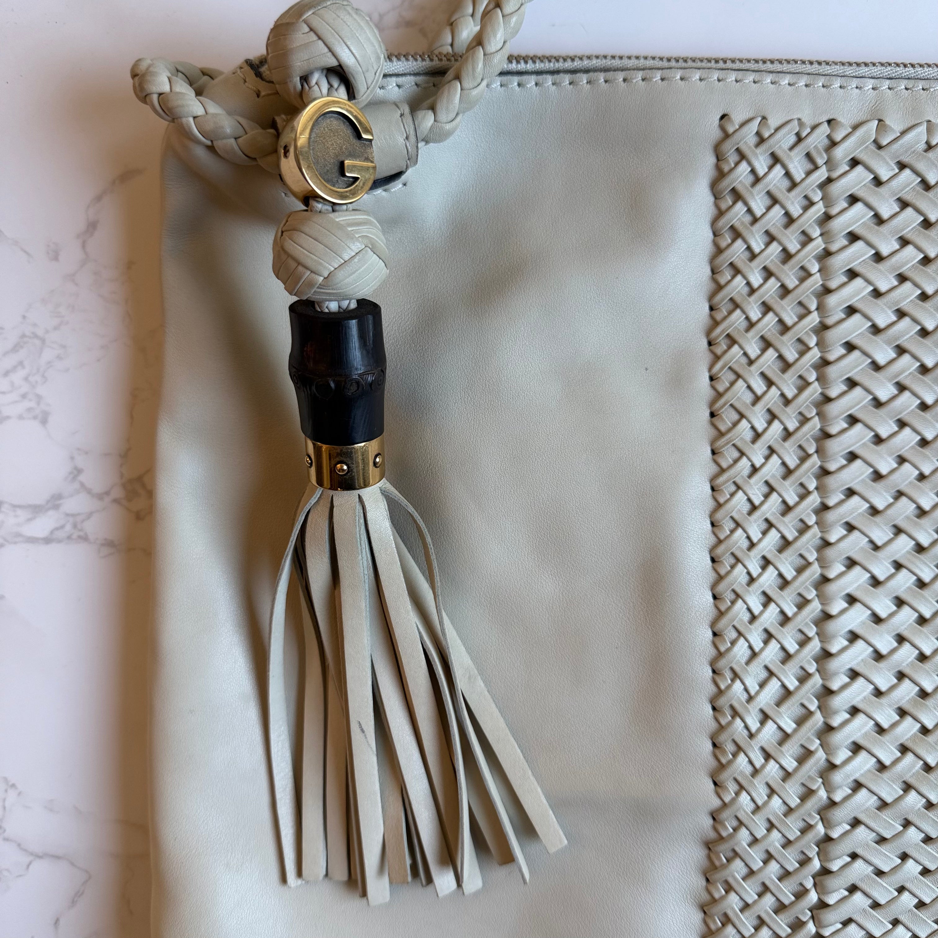 Gucci G charm and fringe tassel detail