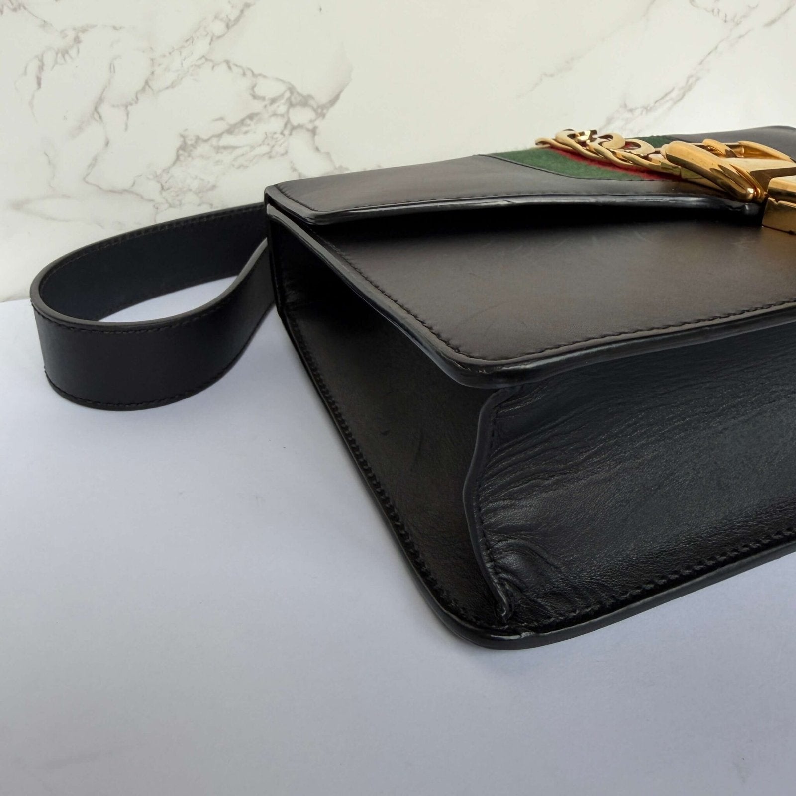 Corners of the Gucci Small Sylvie in black leather
