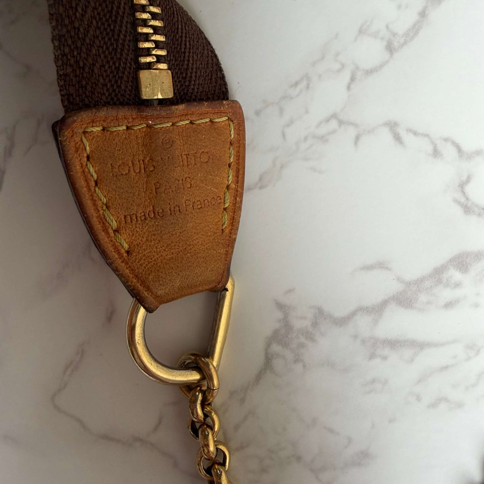 Louis Vuitton Eva monogram detail gold logo