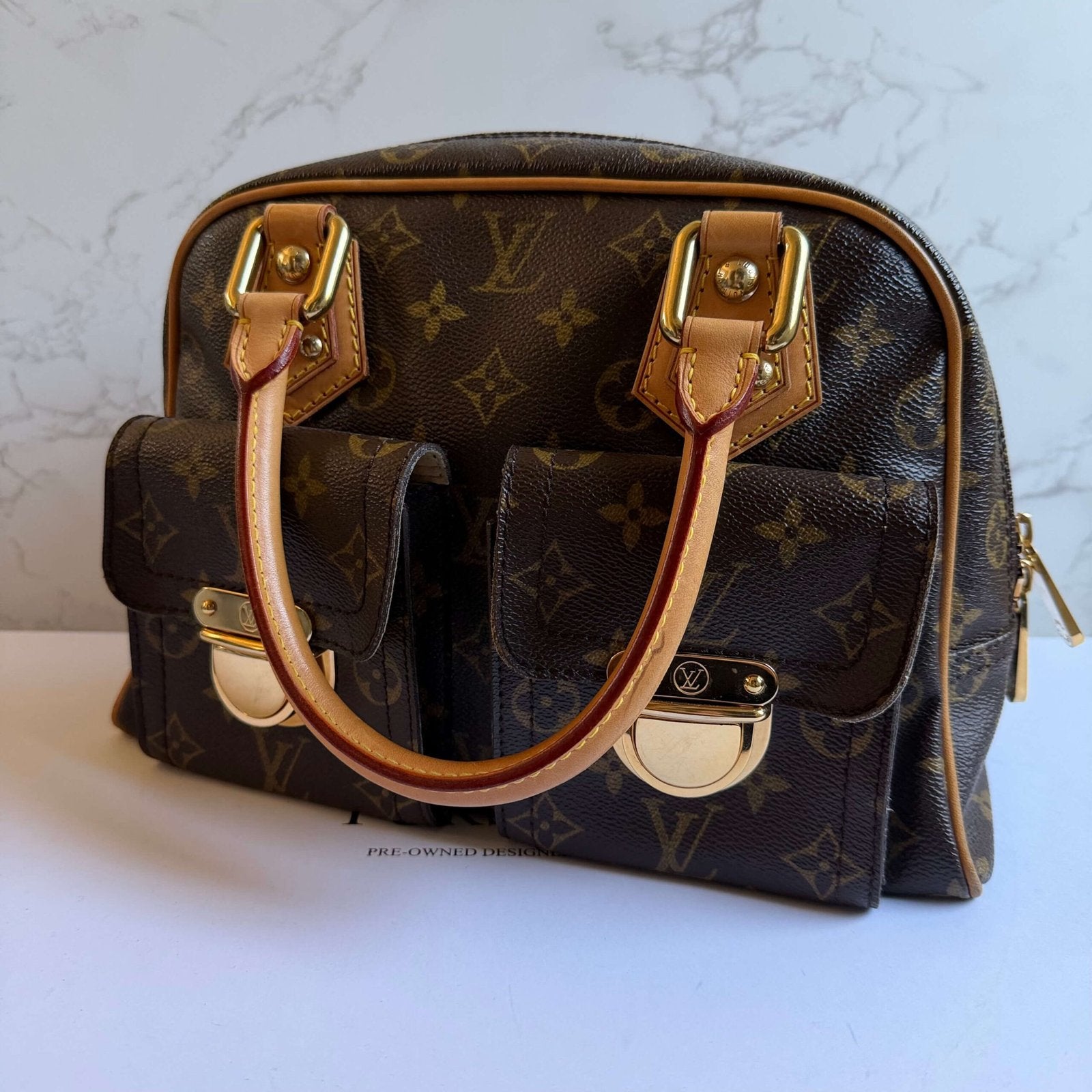 Louis Vuitton Manhattan PM buckle detail