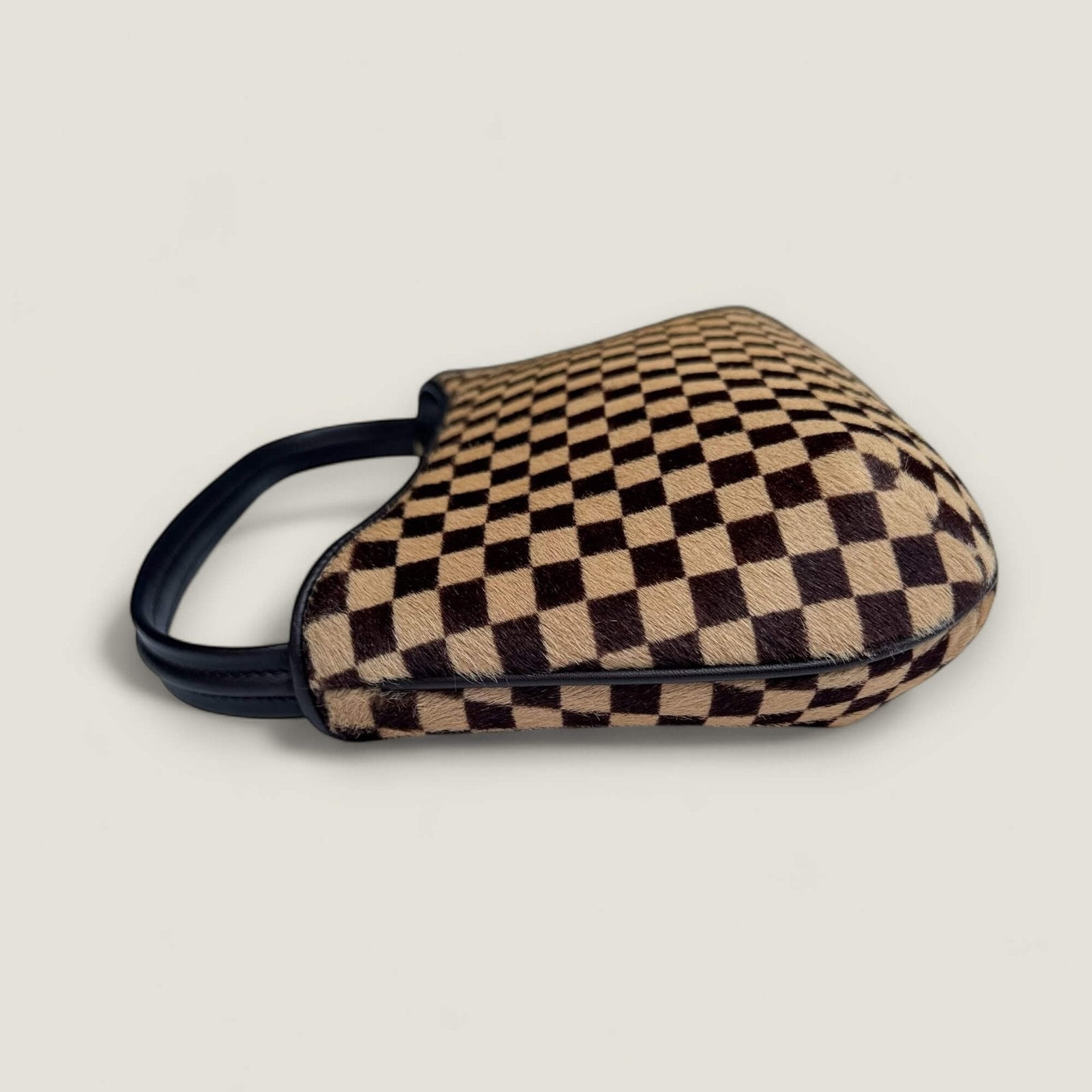 Louis Vuitton Tigre hoekje lichte wrijving