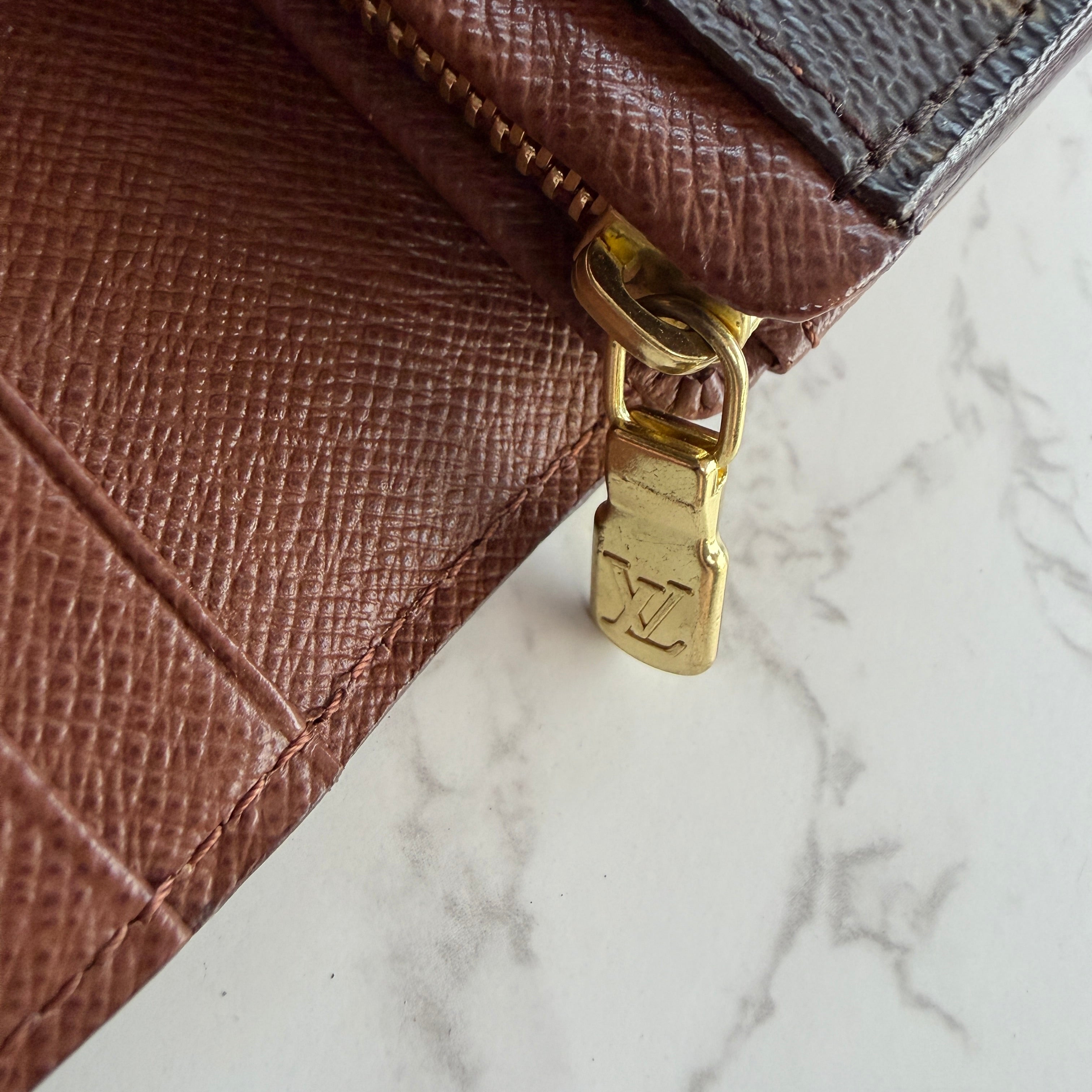 Louis Vuitton portemonnee hardware origineel