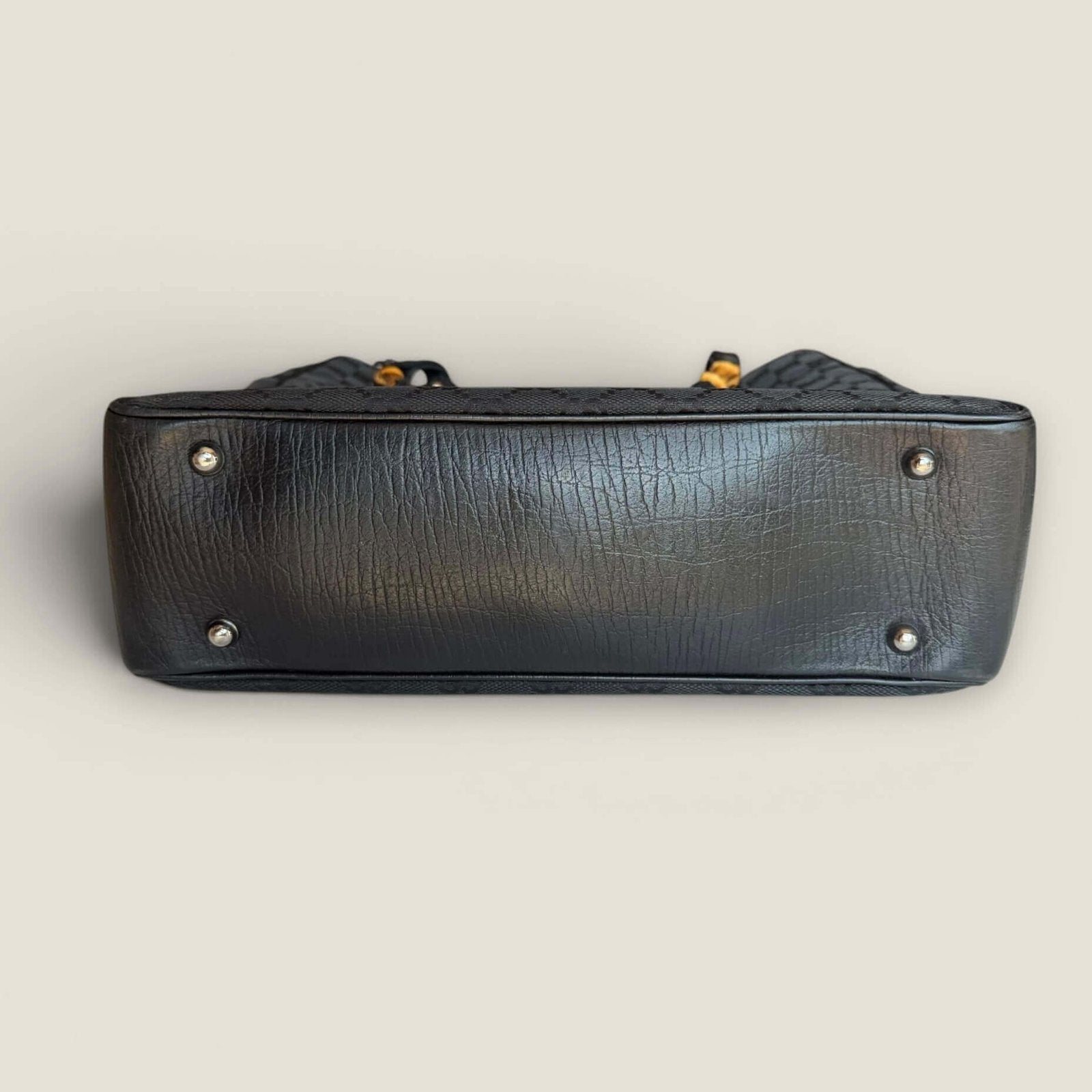 Bottom of Gucci GG Supreme canvas bamboo tote black