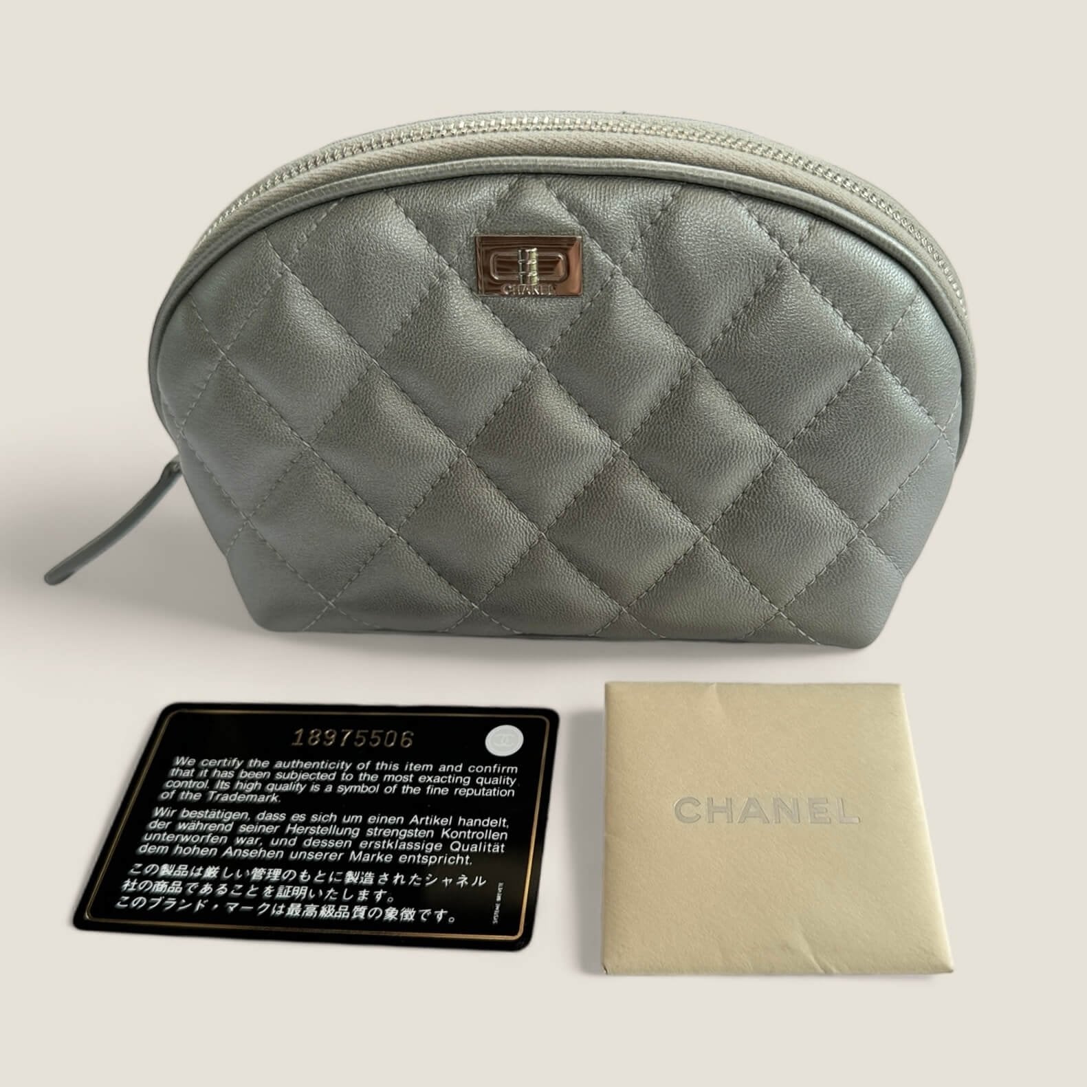 Pre-loved Chanel Cosmetics Pouch silver lambskin leather