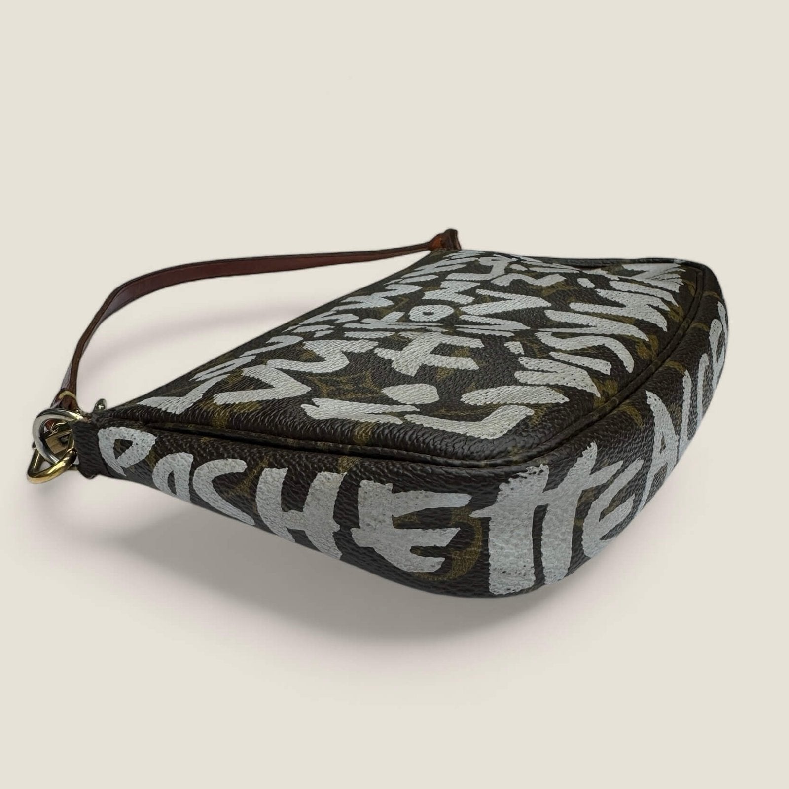 Rare pre-owned limited edition Louis Vuitton x Stephen Sprouse Graffiti Pochette Accessories from 2001