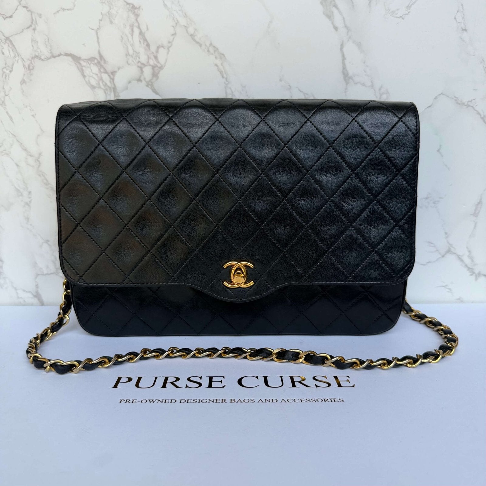 Tweedehands Chanel vintage matelassé single flap donkerblauw lamsleer