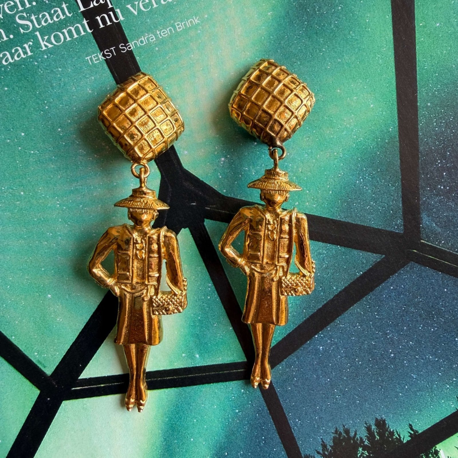 Unique vintage Chanel clip-on earrings featuring Coco Chanel figurines