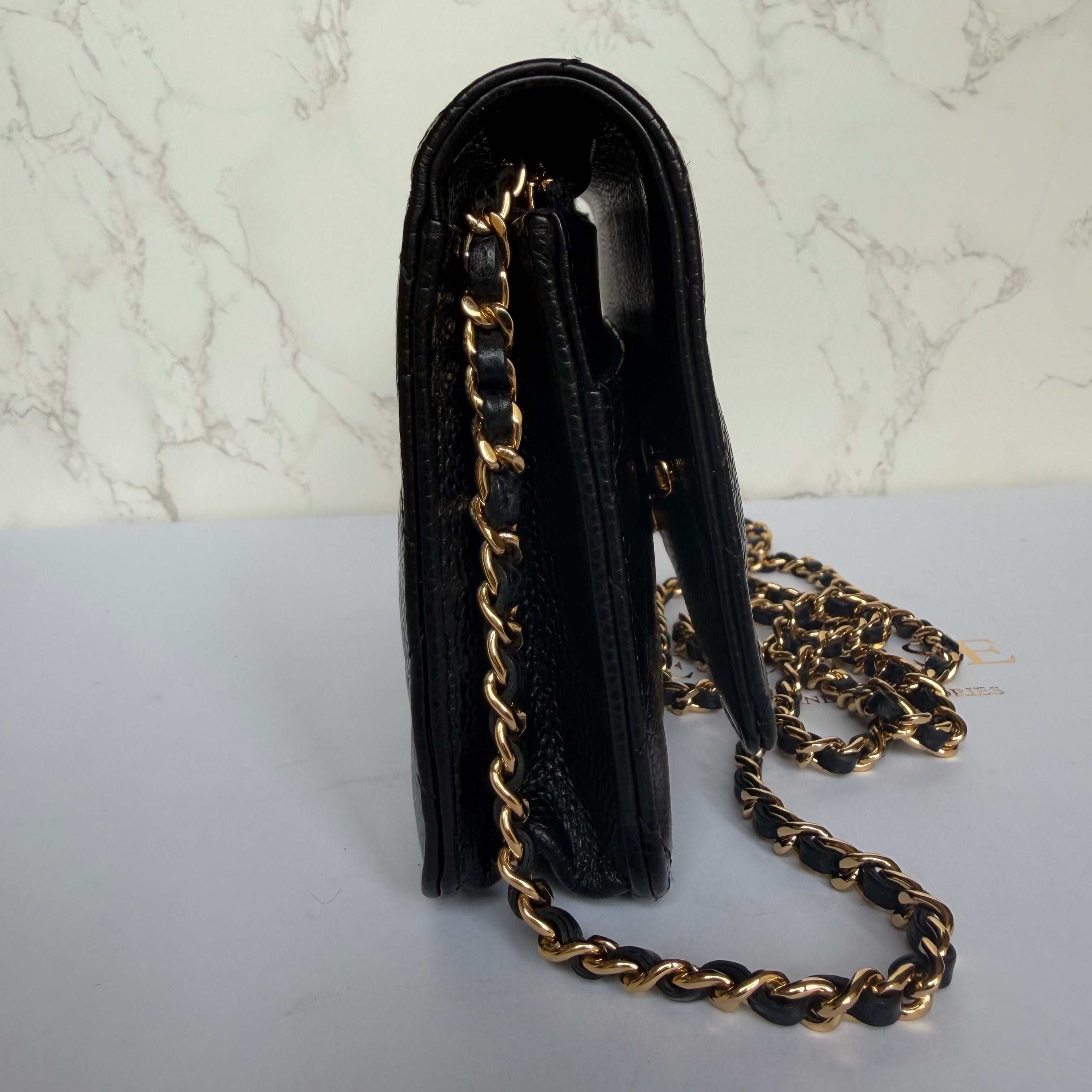 Side view authentic Chanel wallet on chain