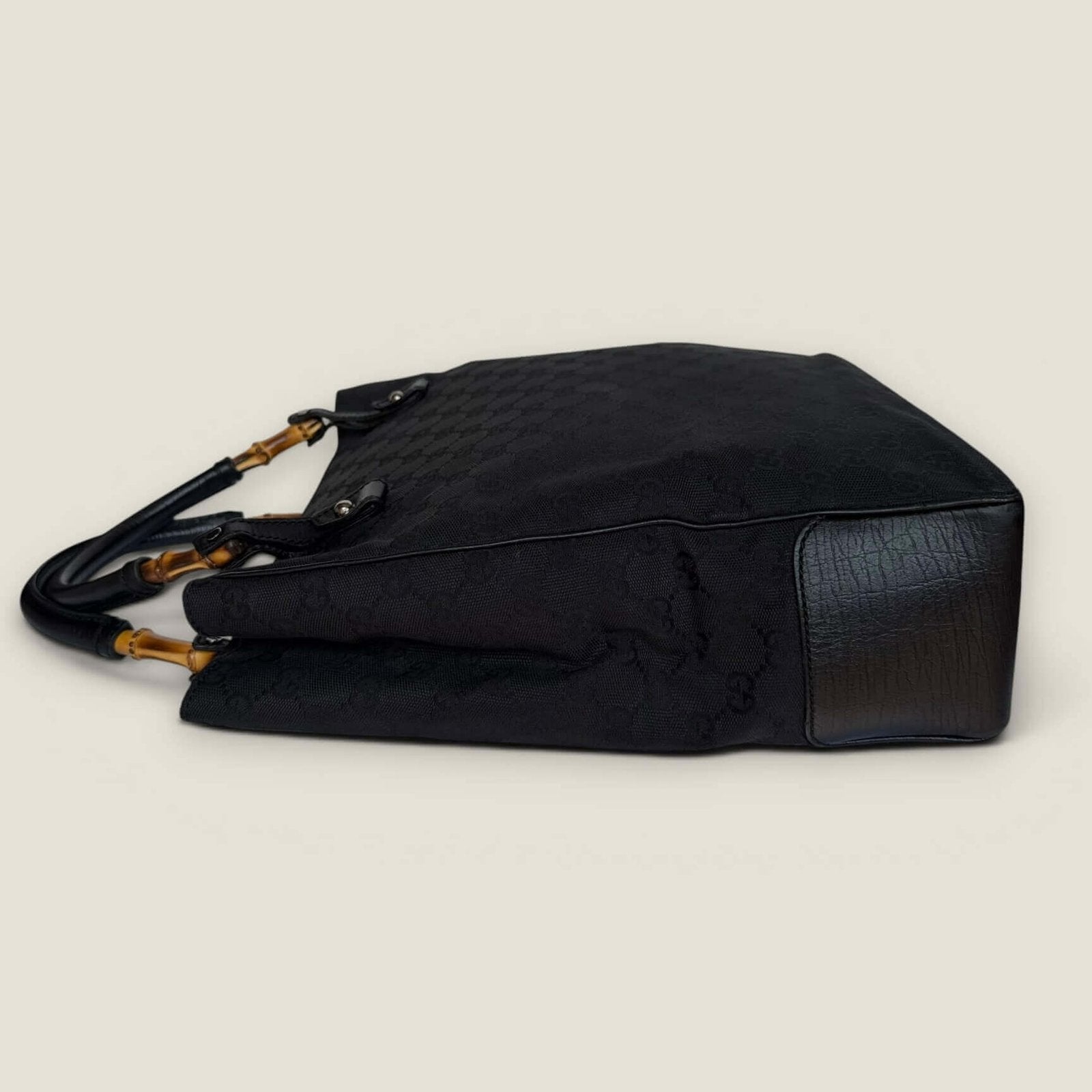 Side of Gucci bamboo GG Supreme black