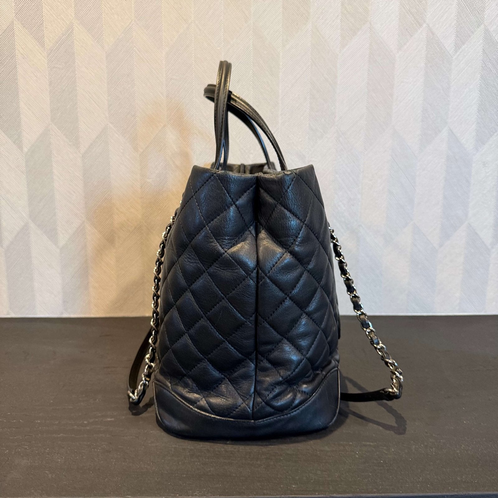 Side view of original Chanel calfskin quilted large shopping tote