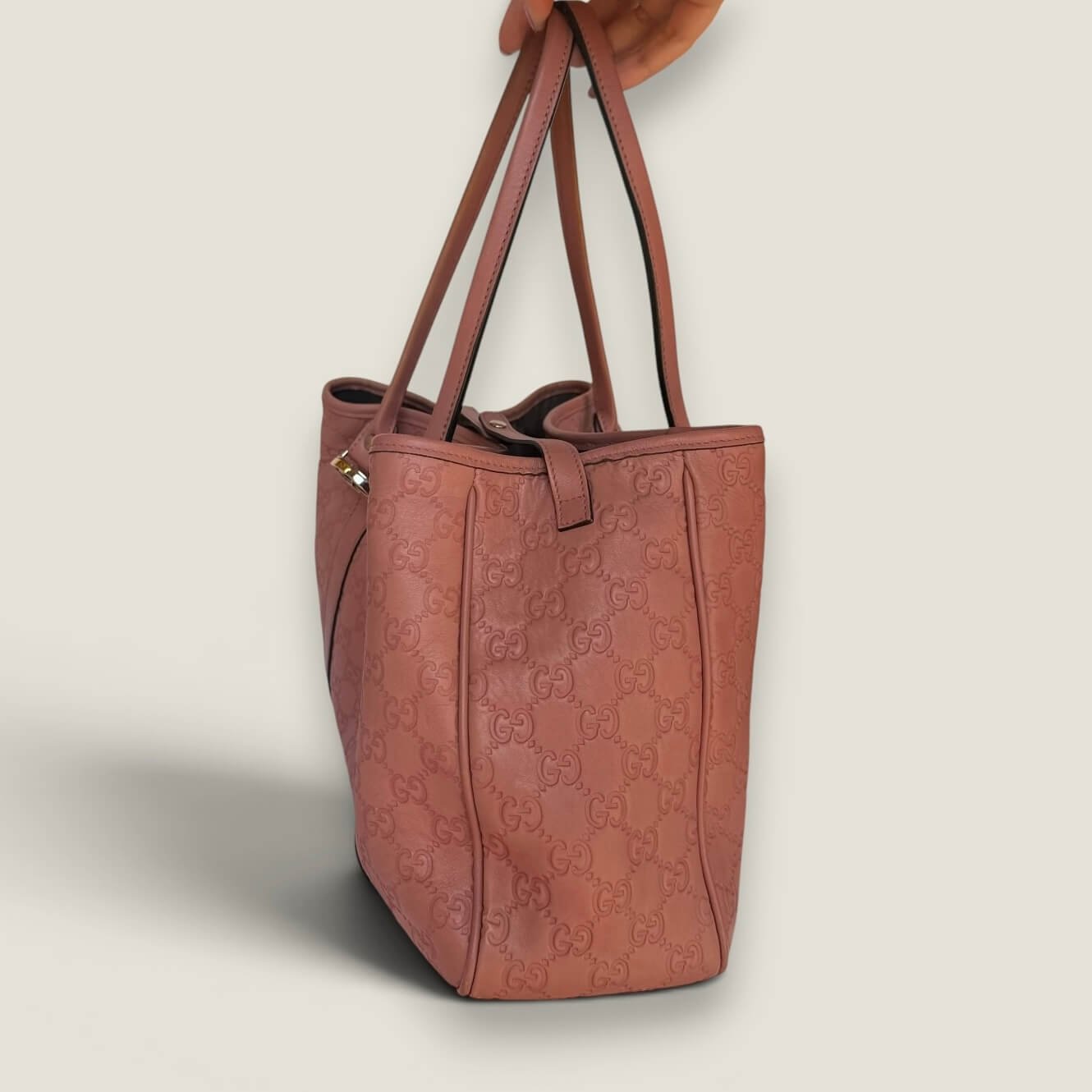 Zijkant originele leren Gucci tote