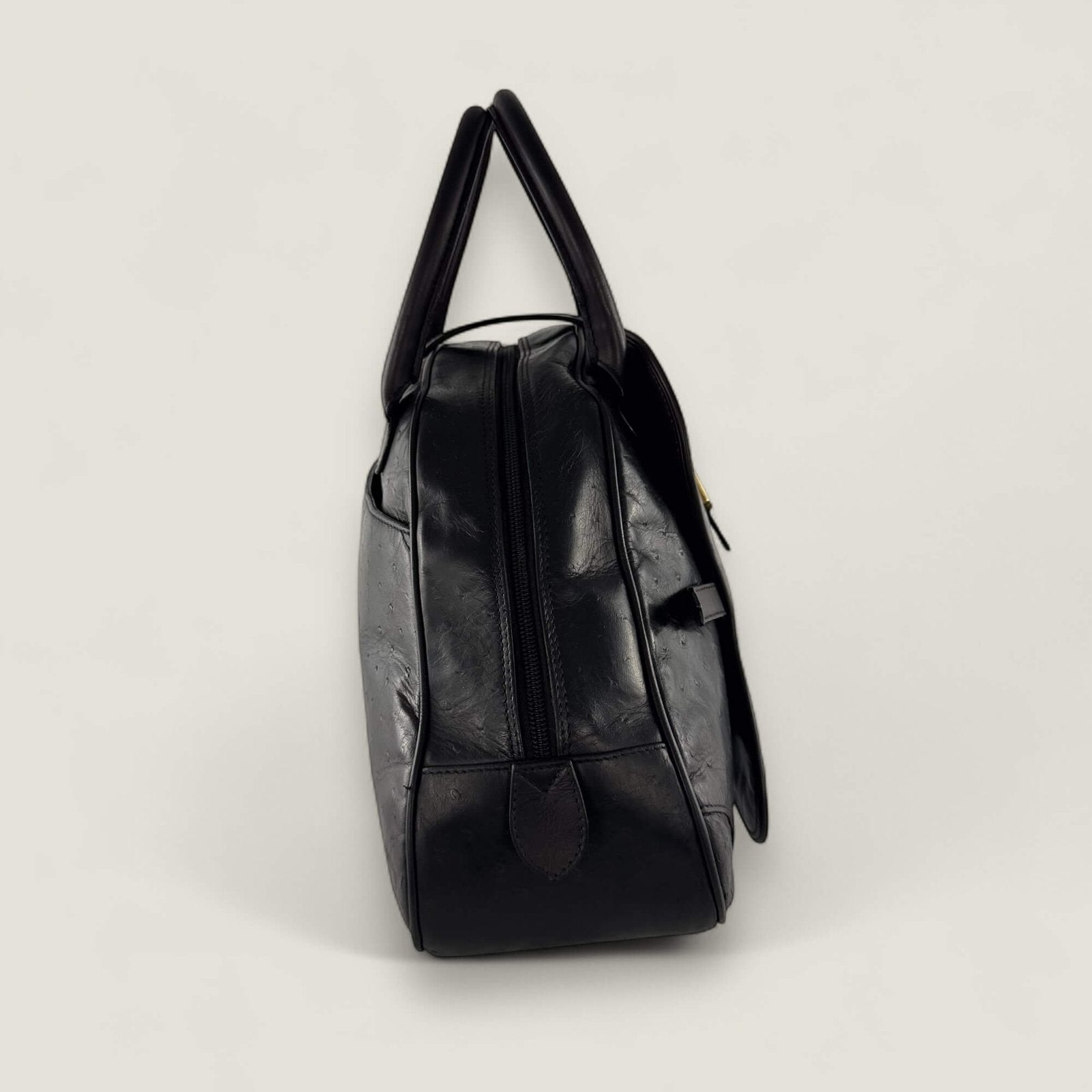 Zijkant tweedehands Dior saddle handtas